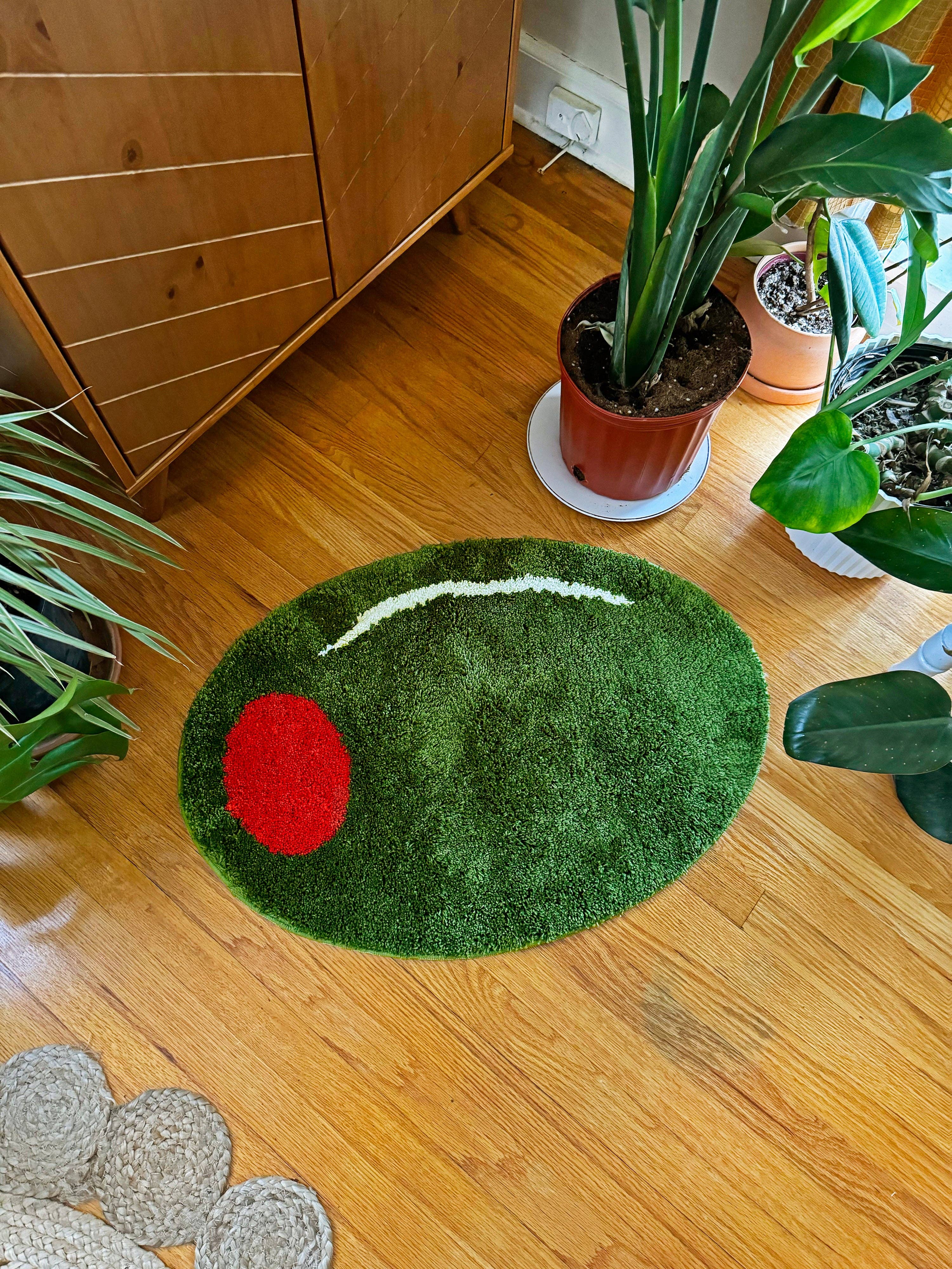 Olive Rug near some plants on the floor