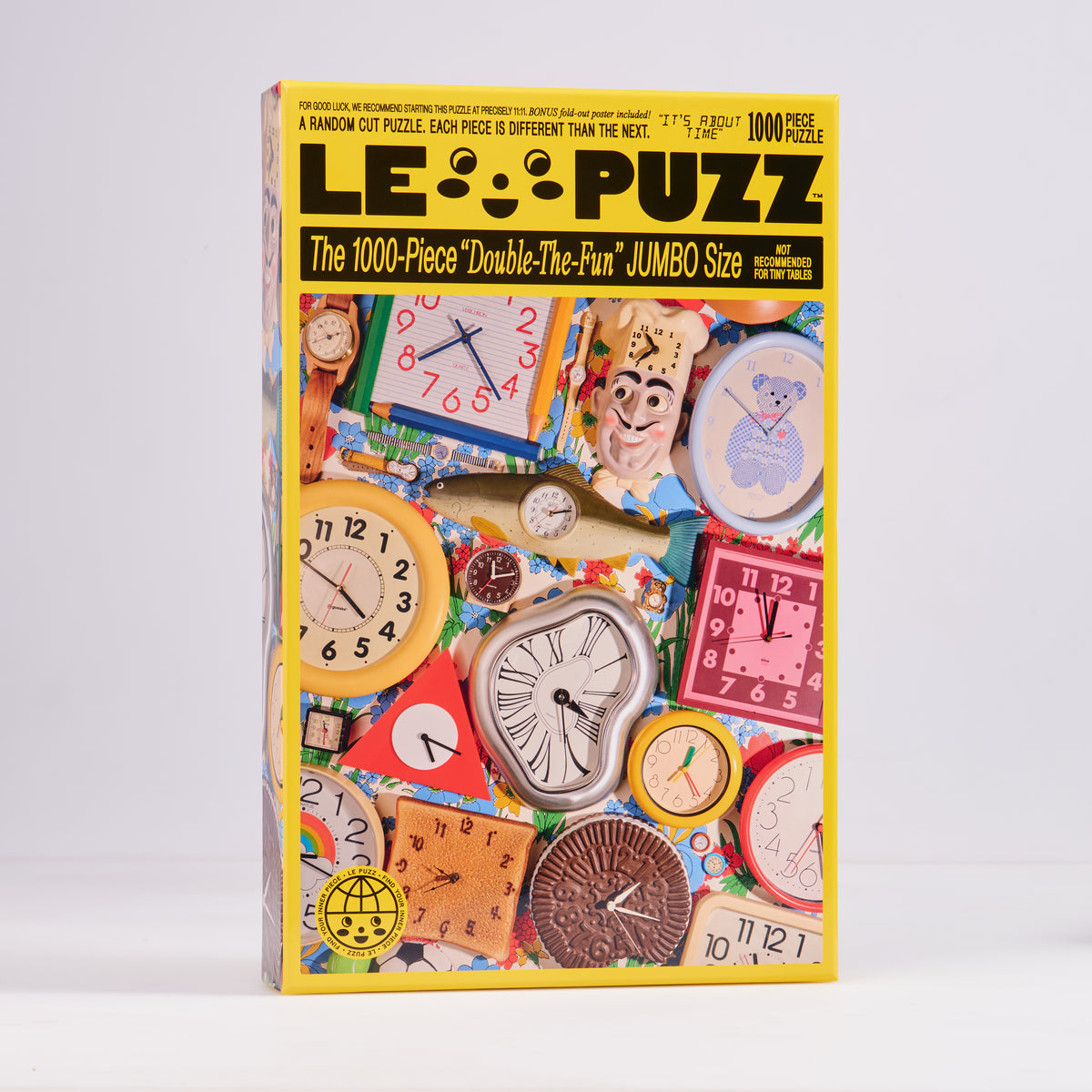 Le Puzz It’s About Time 1000-piece puzzle box featuring colourful novelty clocks and watches.