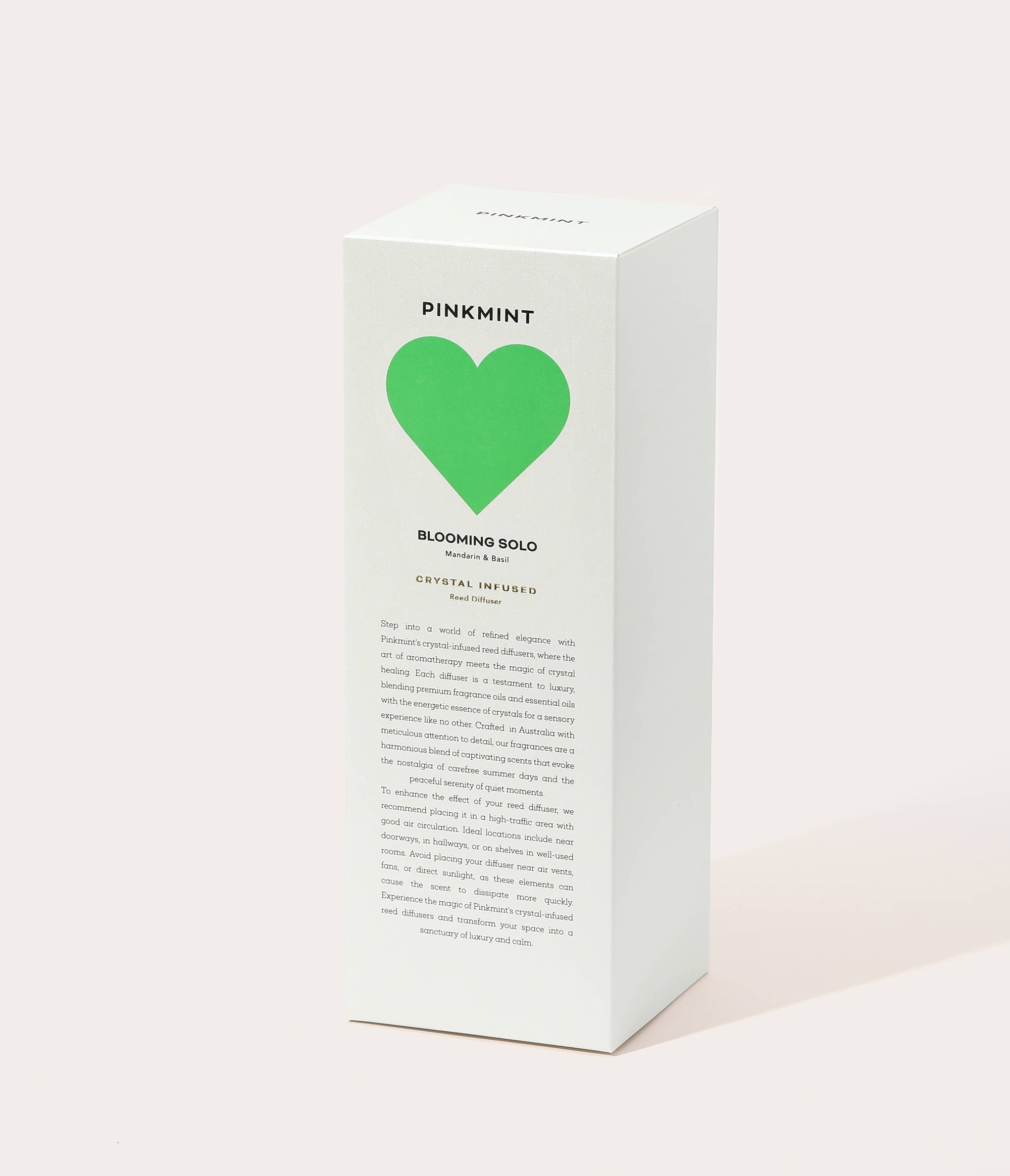 White product box with a green heart and 'Pinkmint' branding on a light background