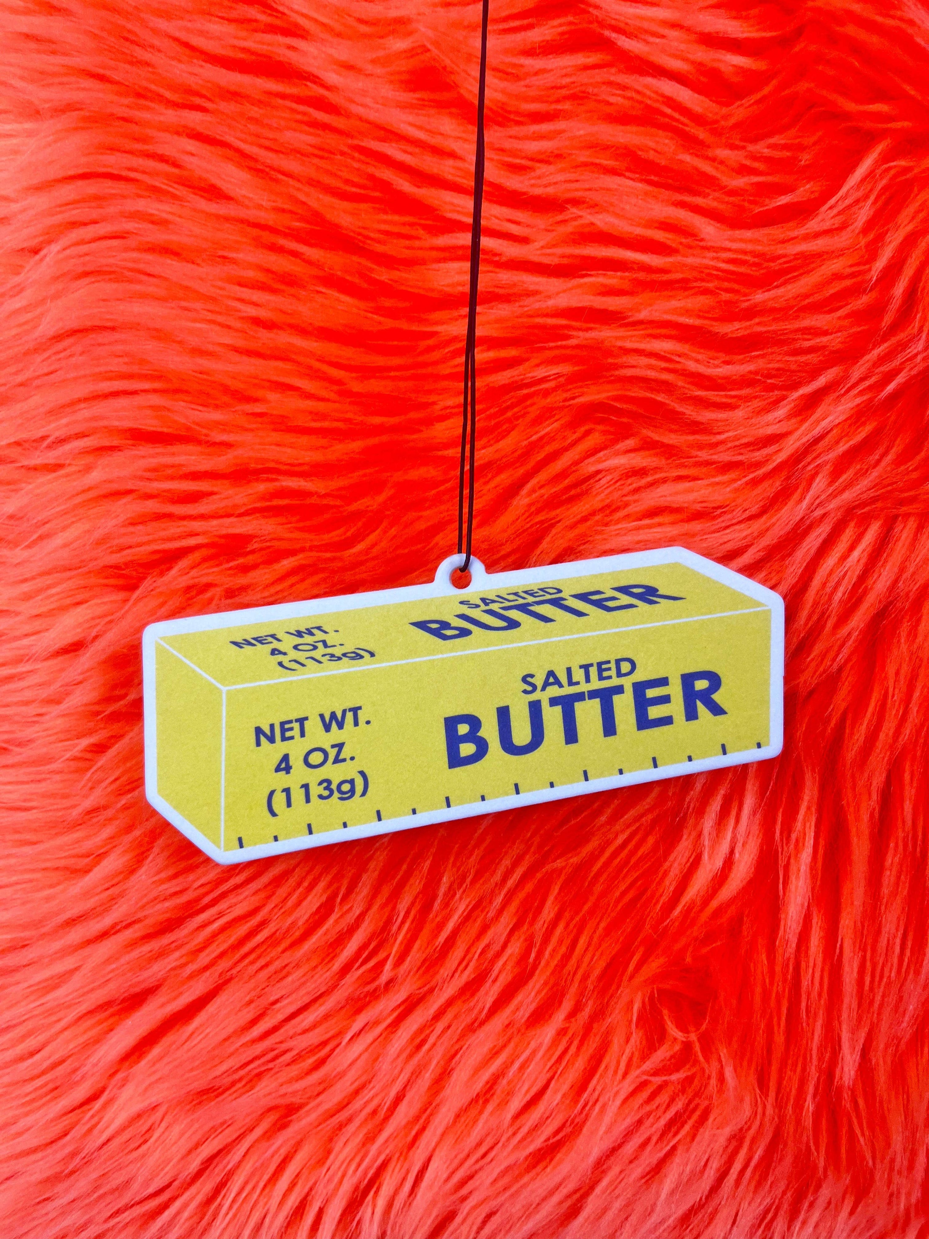 Butter Air Freshener with red background