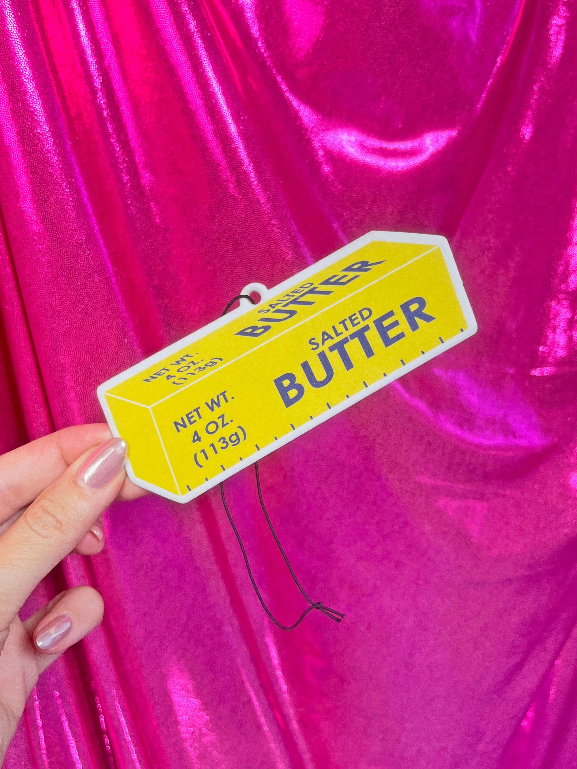 Butter Air Freshener with purple background