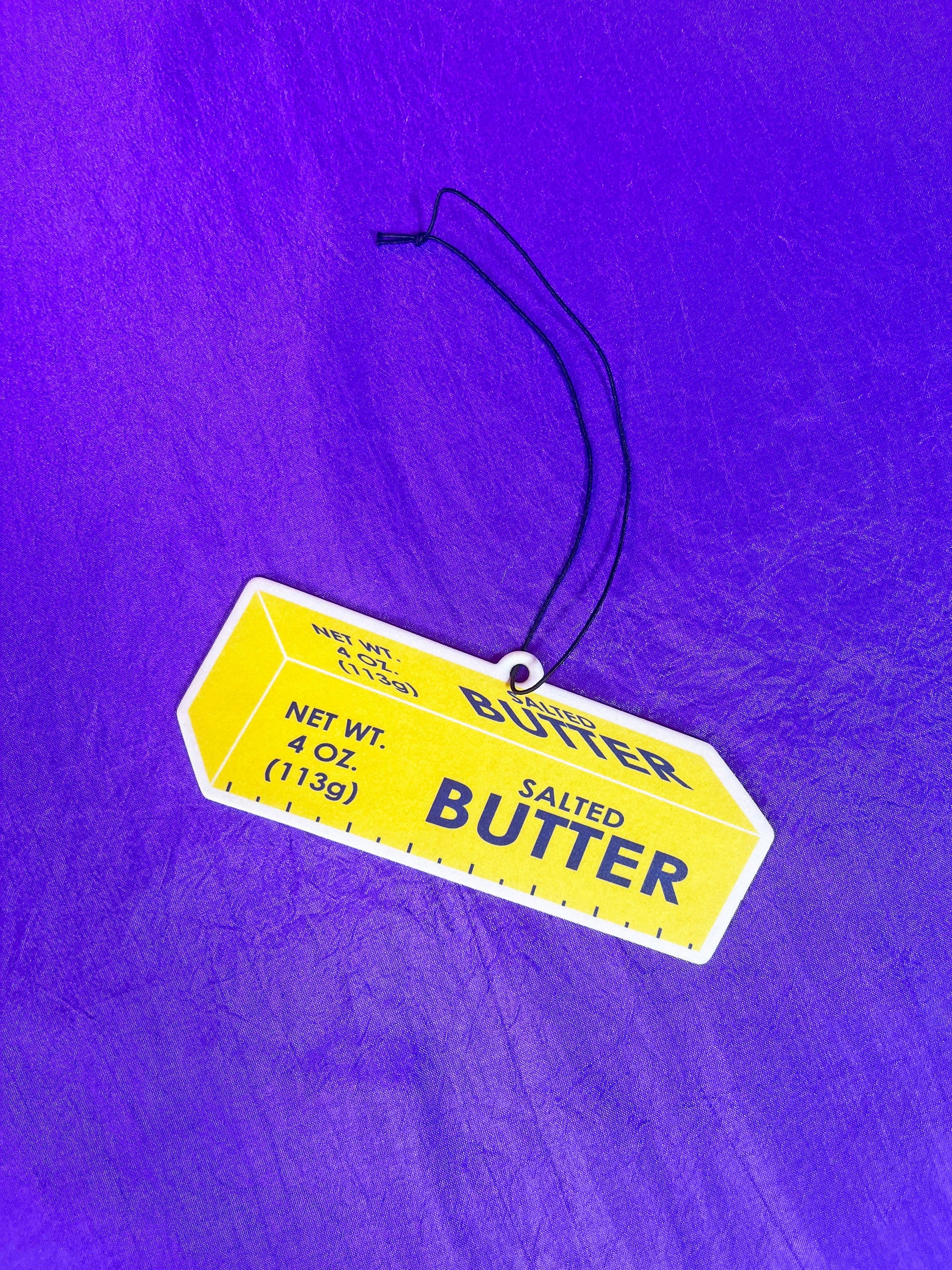 Butter Air Freshener with purple background