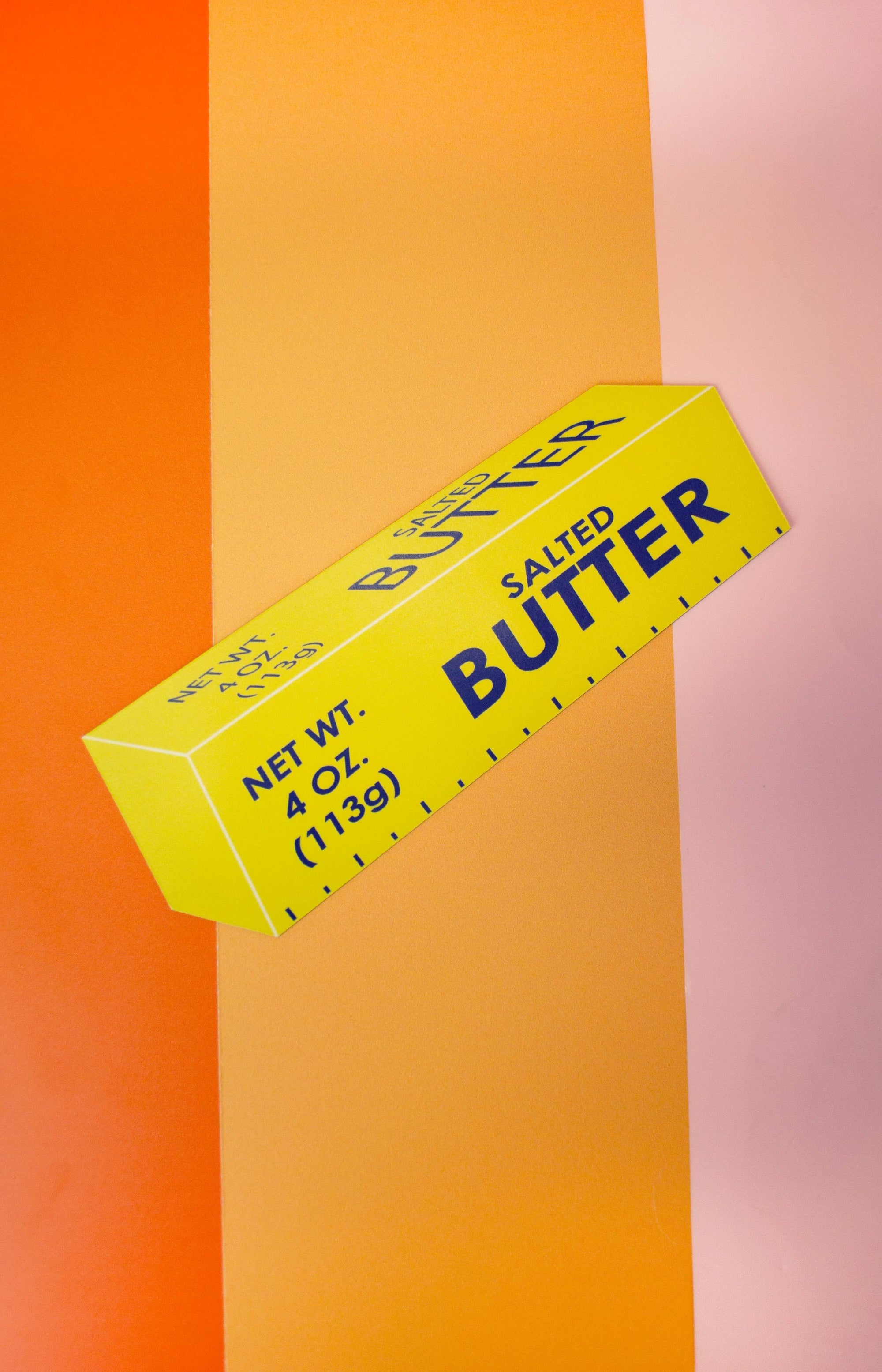Butter Car Magnet with colours behind pink orange and burnt orange