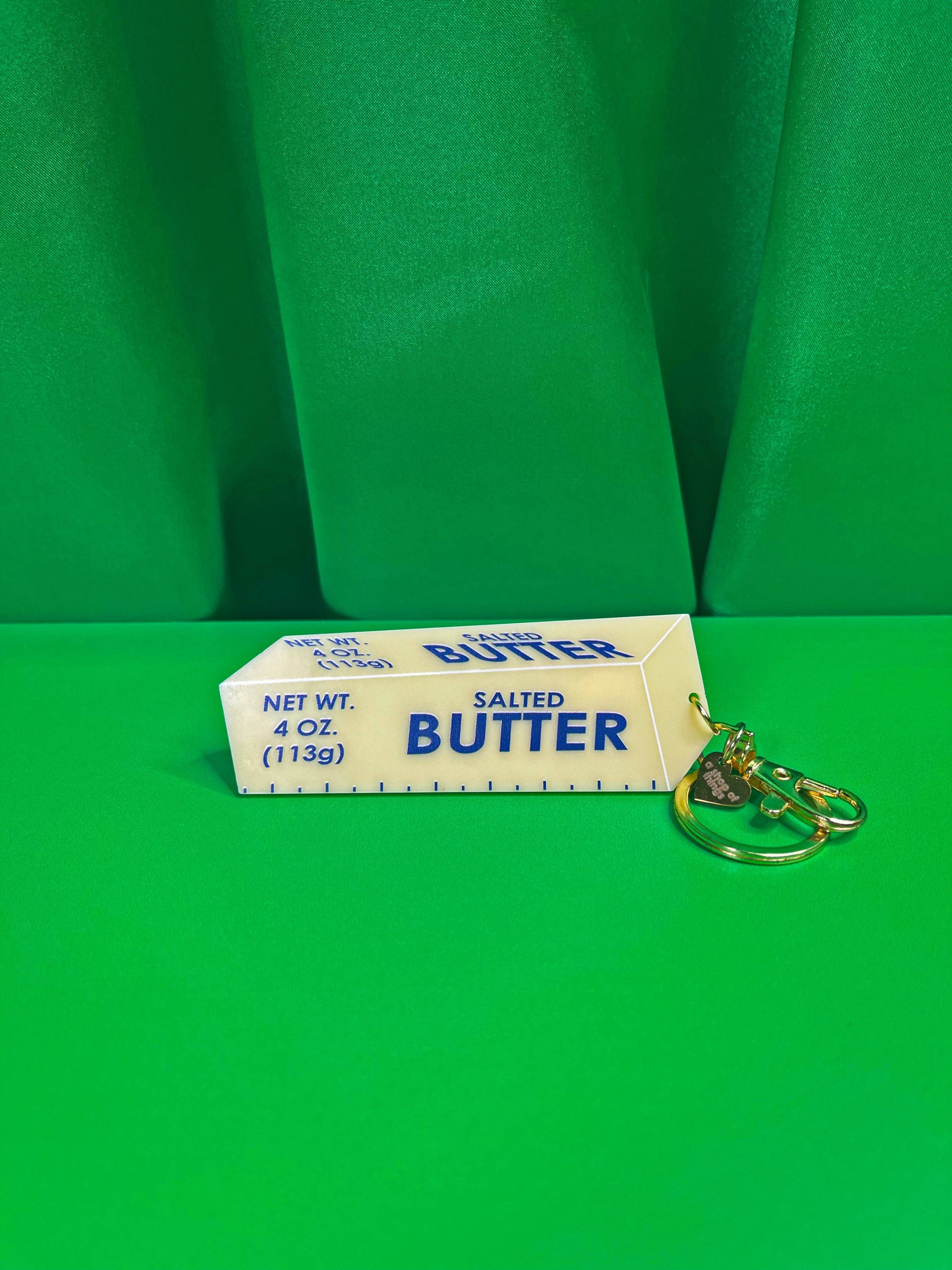 Butter Keychain with green background