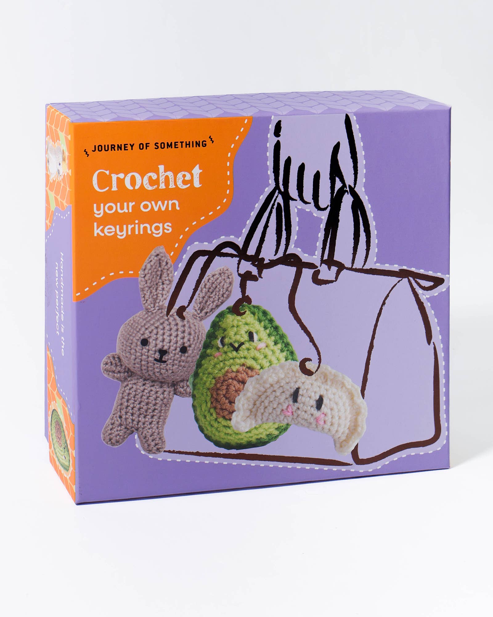 Box for crochet keyring kit with illustrations of a bunny, avocado, and dumpling on a purple background.