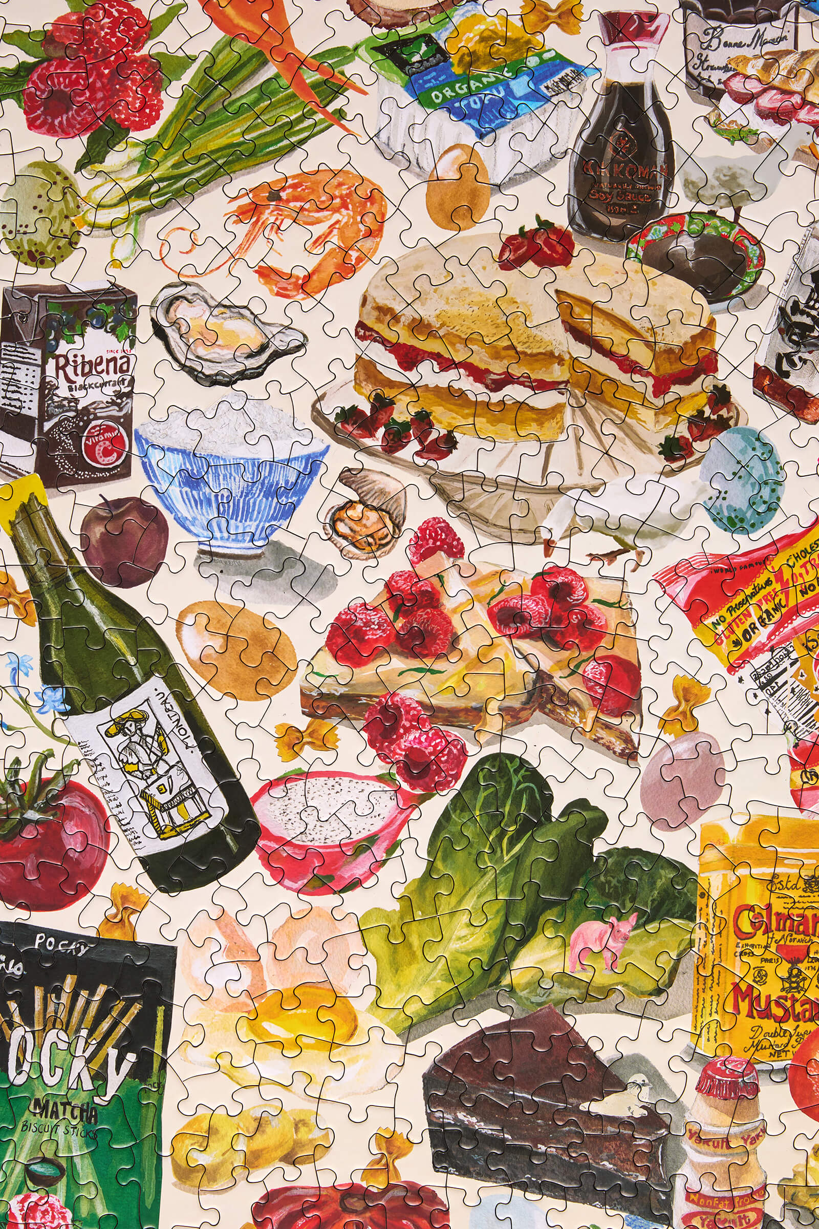 Partial puzzle of a food-themed design with various items including sandwiches, bottles, and fruits.