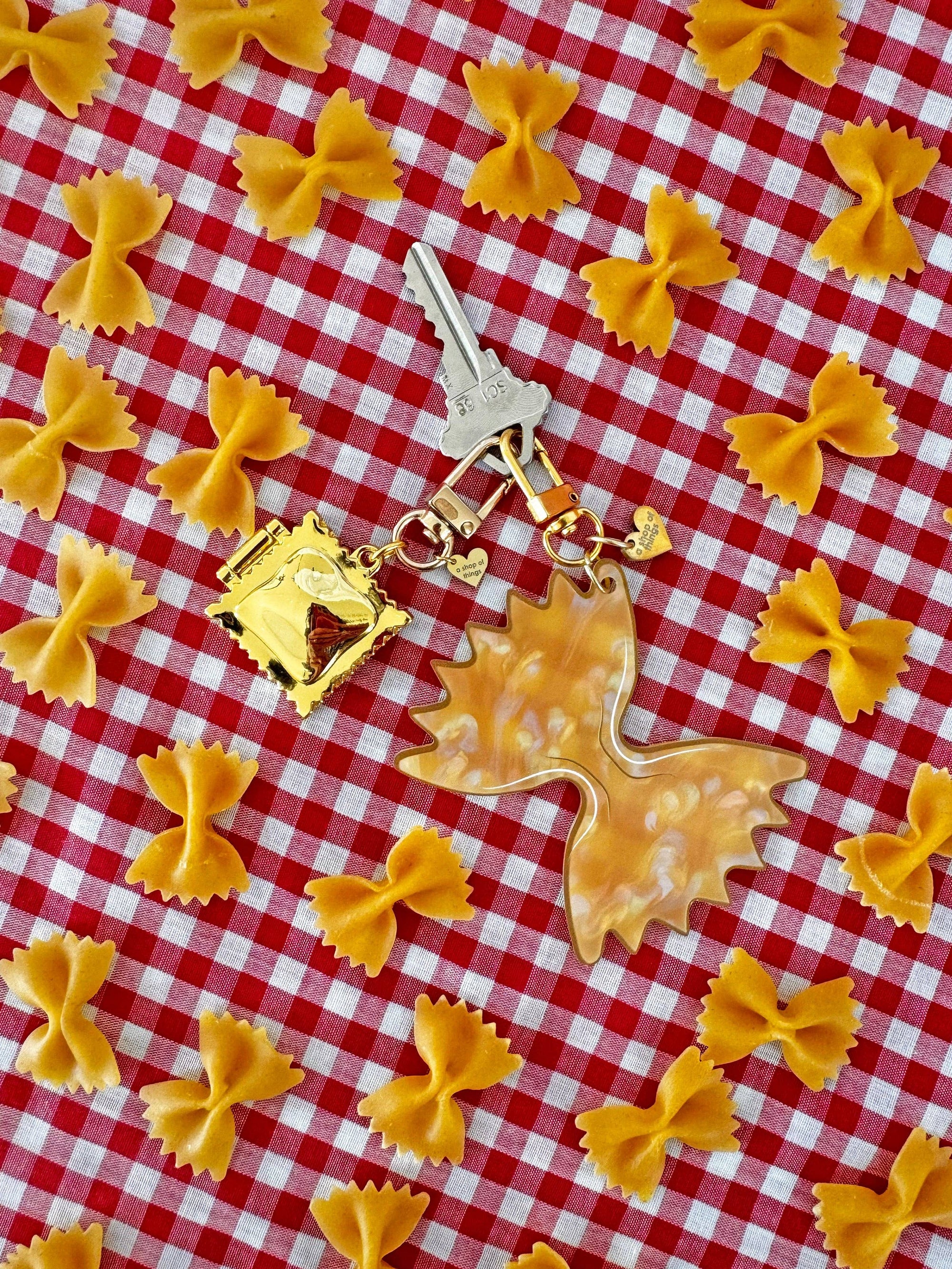 Farfalle Pasta Keychain with bowtie pasta and red and white tablecloth