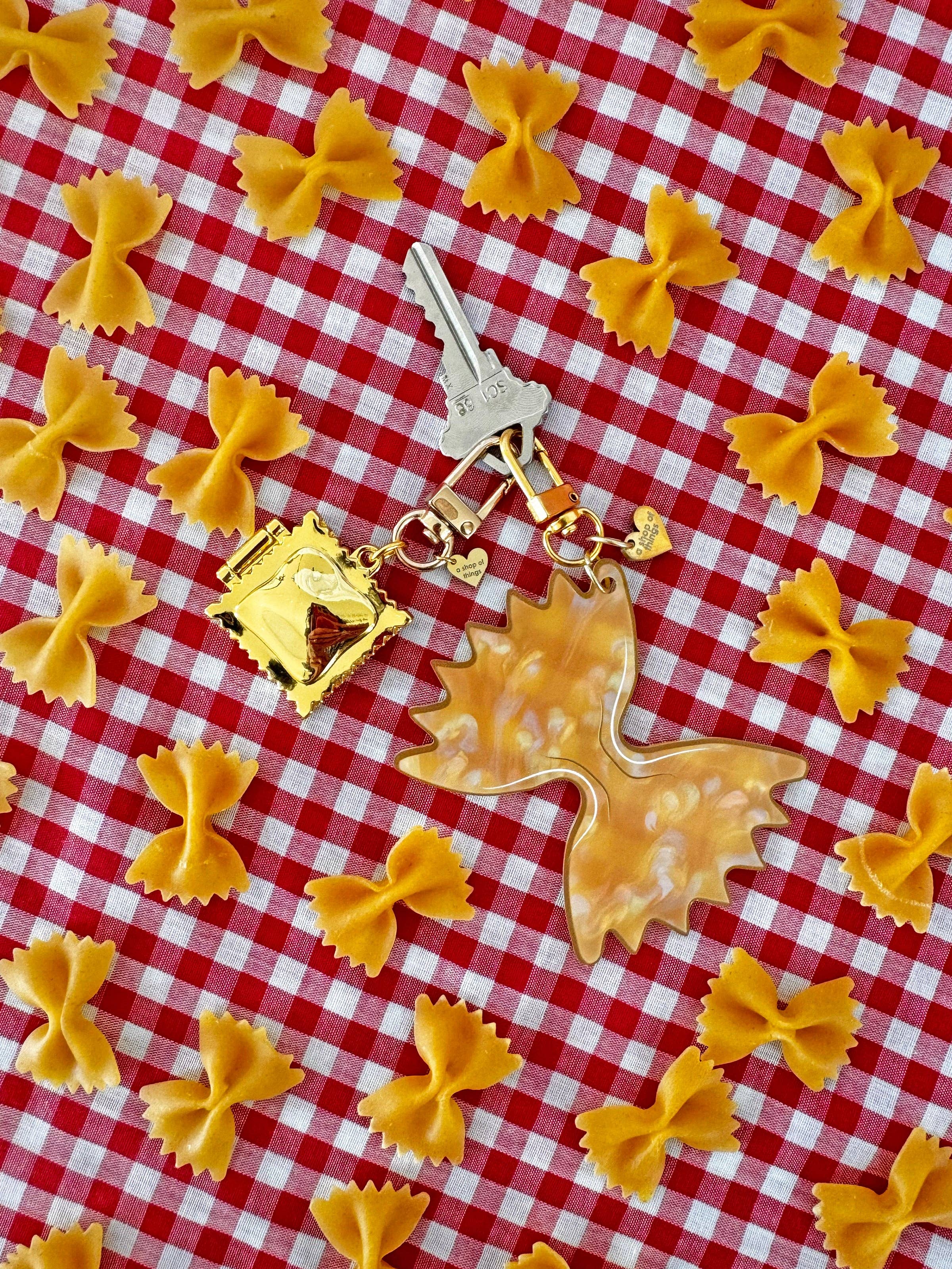 Farfalle Pasta Keychain with bowtie pasta and red and white tablecloth