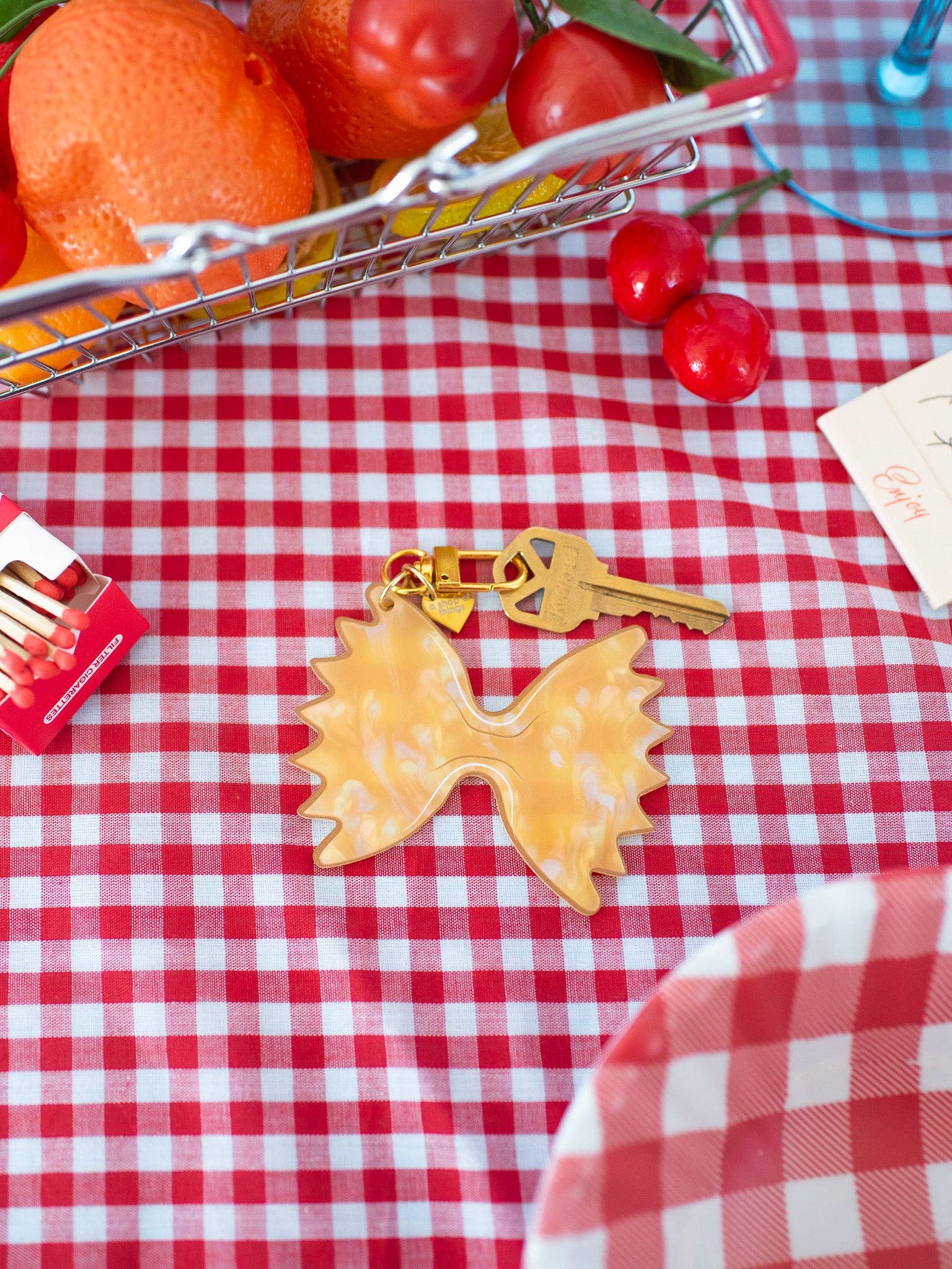 Farfalle Pasta Keychain with red and white tablecloth