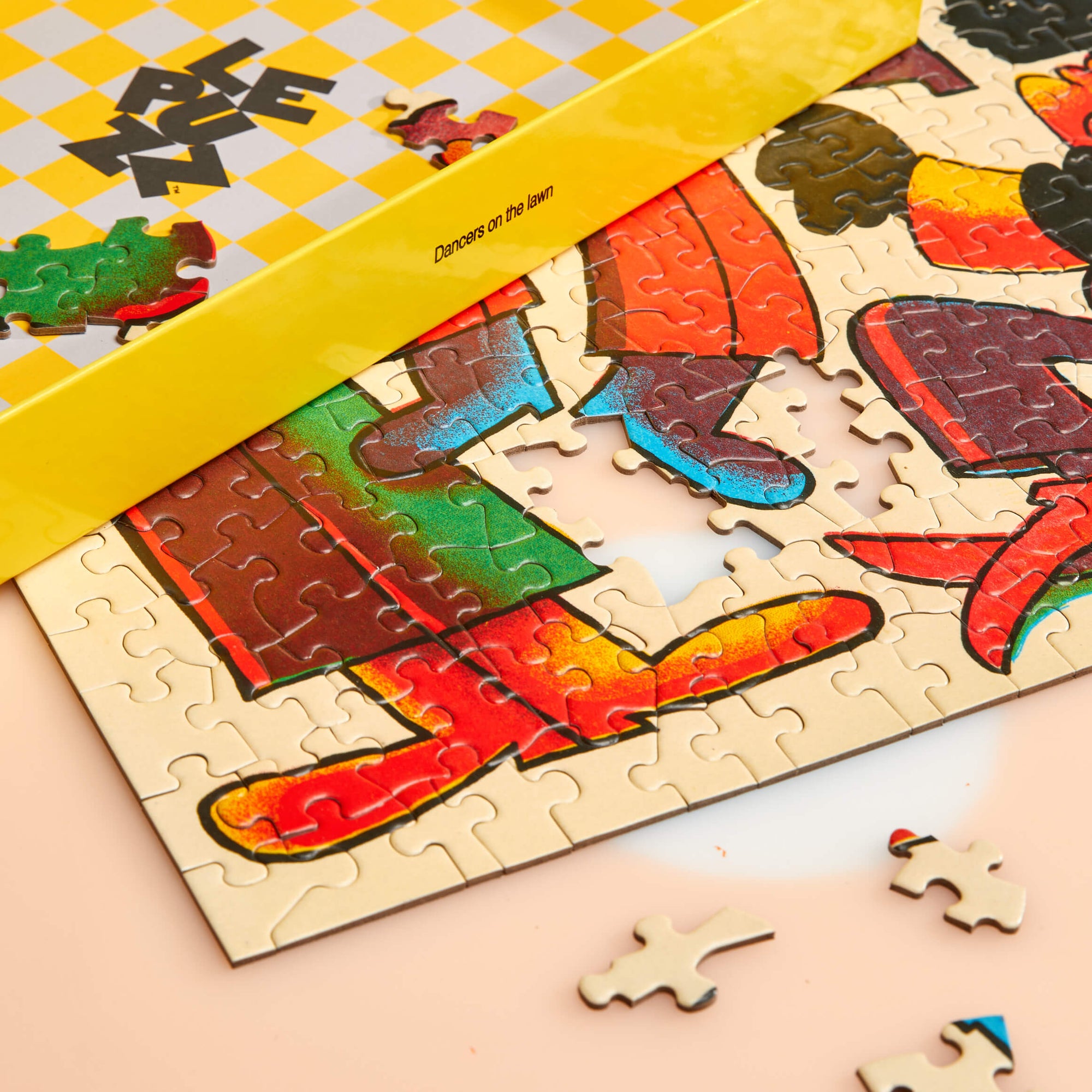 Colorful puzzle with a yellow box on a checkered background