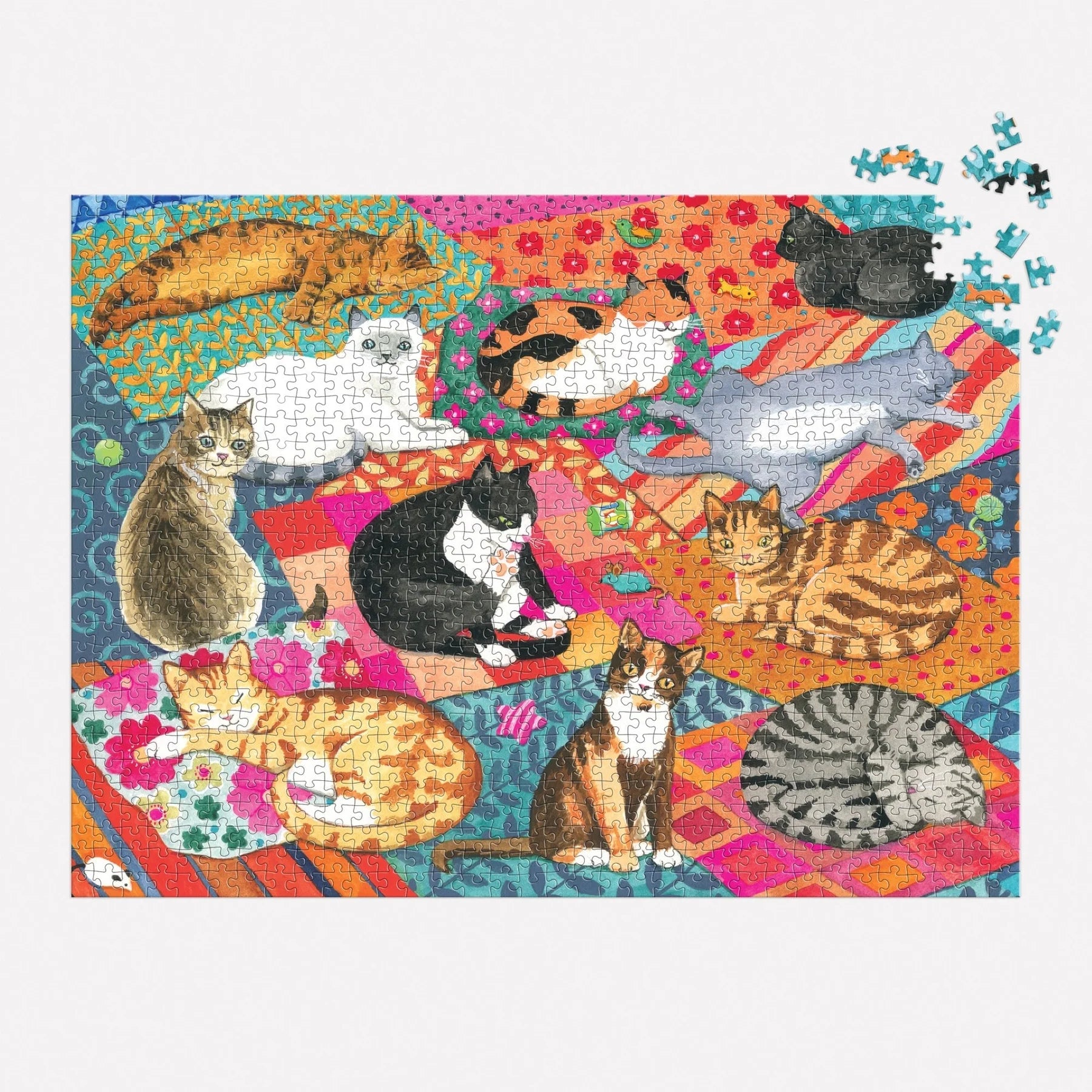 Jigsaw puzzle with colorful cat illustrations on a patterned background
