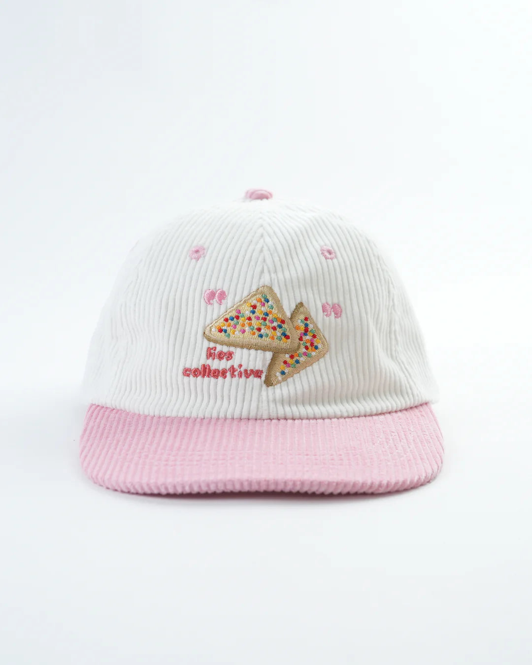 Pink and white cap with embroidered design on a light gray background