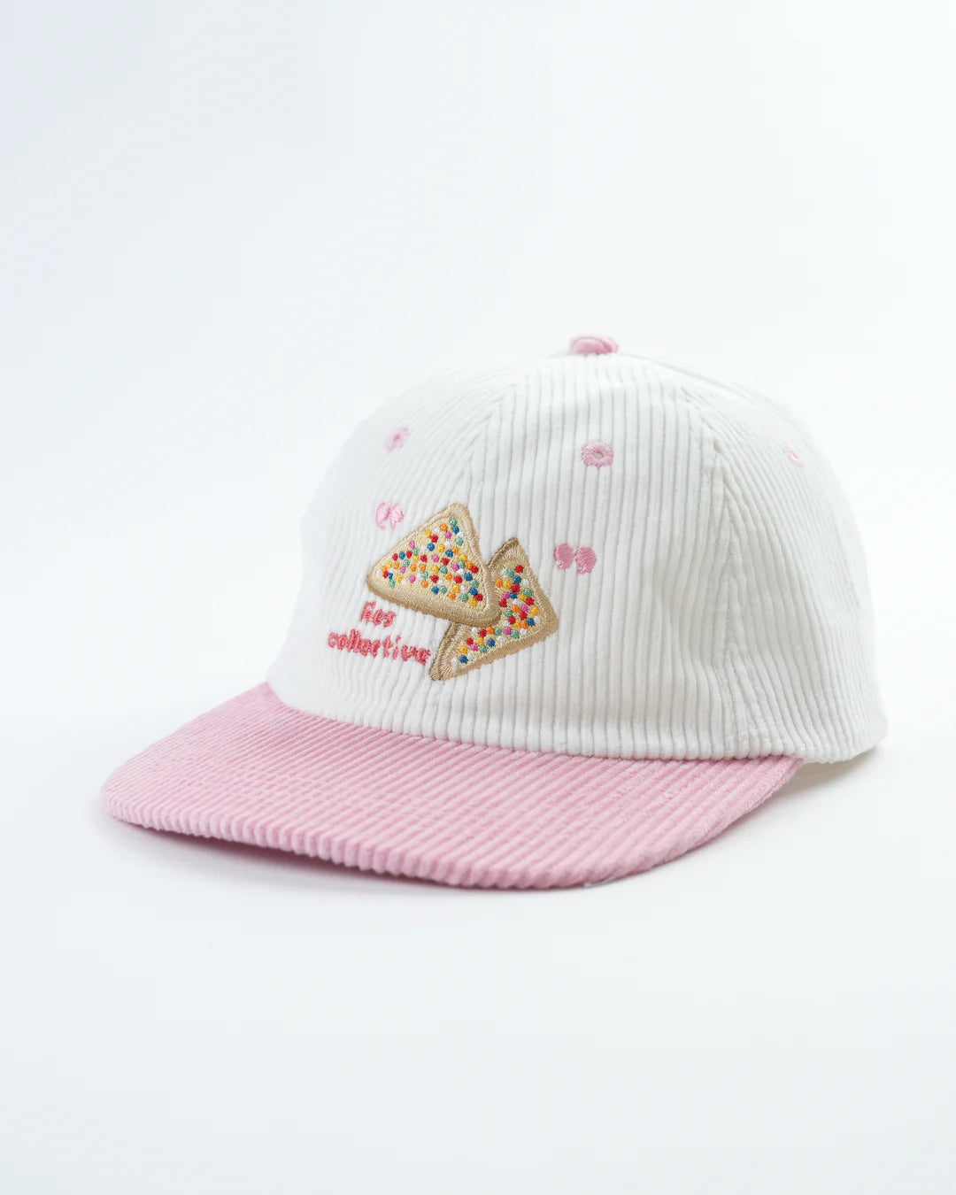 White and pink cap with a fairy bread design on a white background