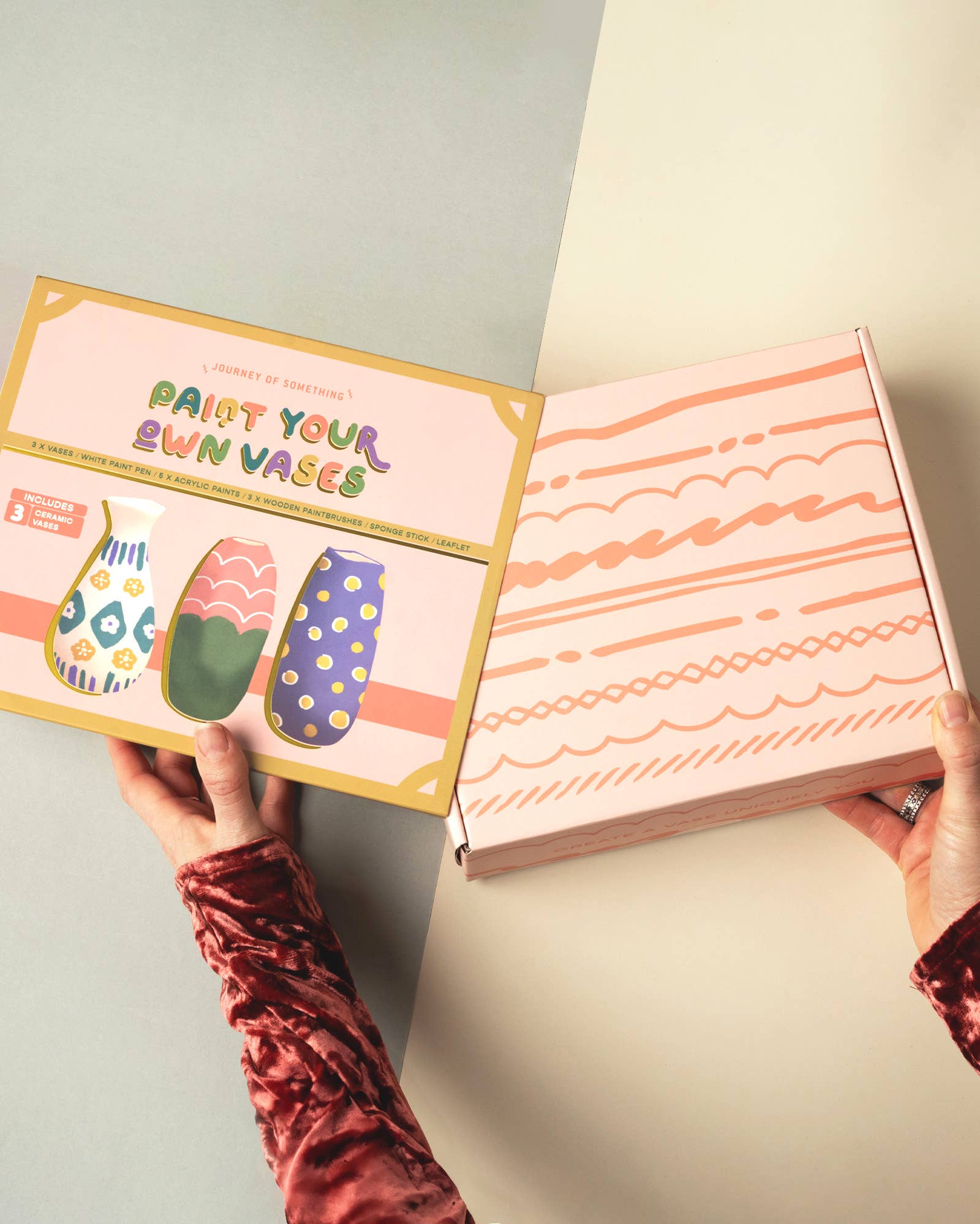 Unboxing of a craft kit with colorful packaging on a neutral background