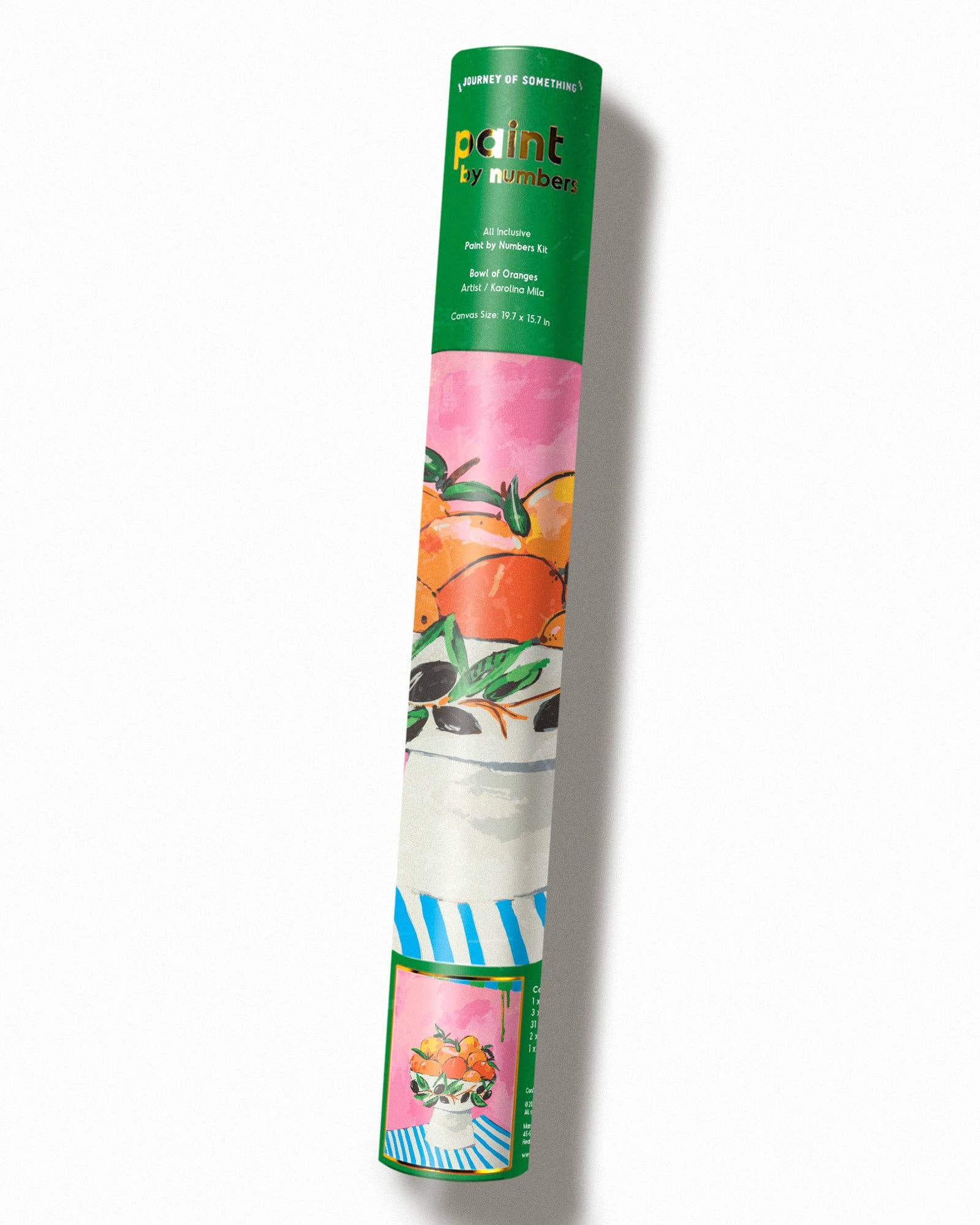 Roll of wallpaper with colorful design and green packaging on a white background
