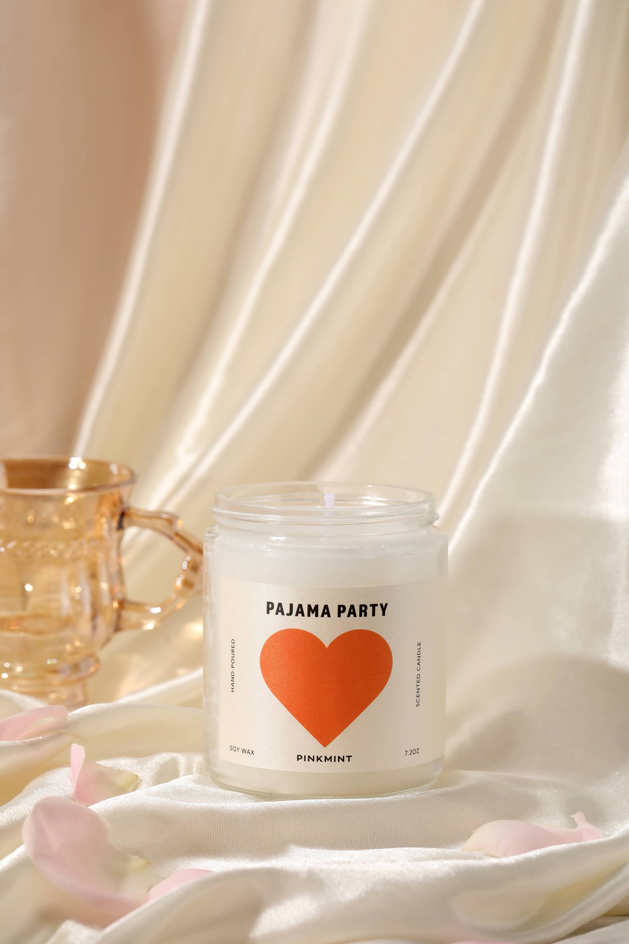 Candle labeled 'Pajama Party' with a red heart on a white background