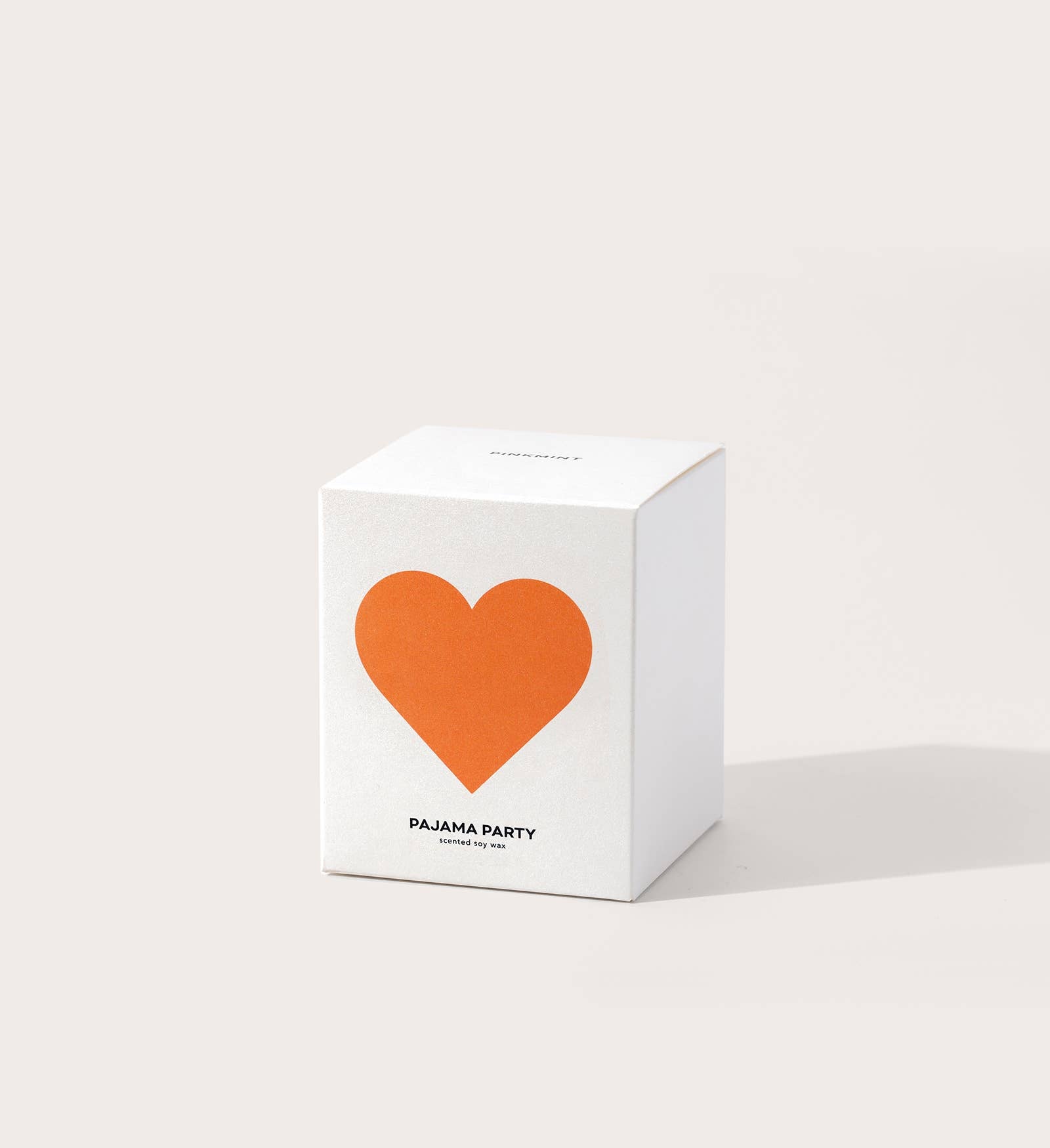 White box with an orange heart and 'Pajama Party' text on a light gray background