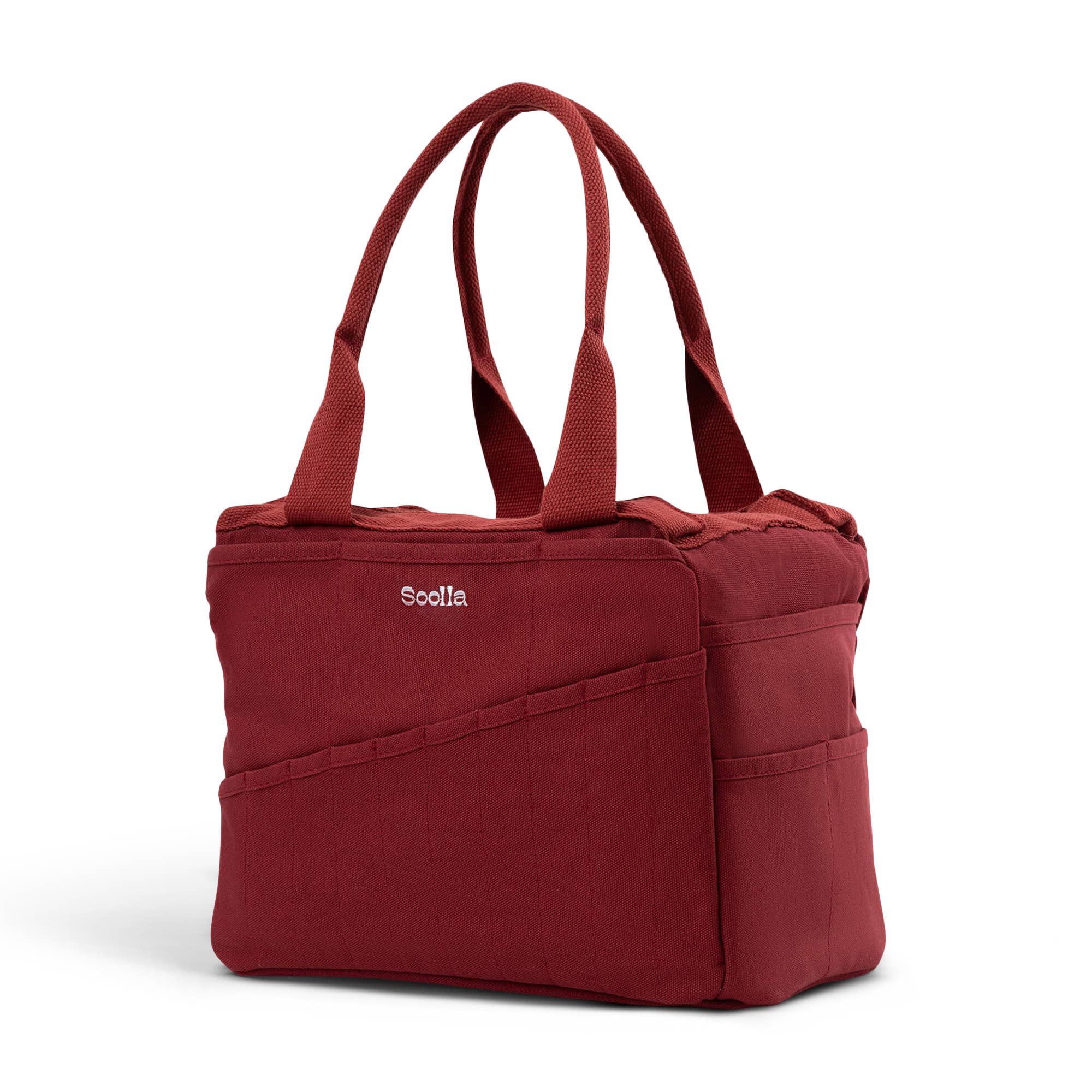 Red tote bag with 'Soolla' branding on a white background