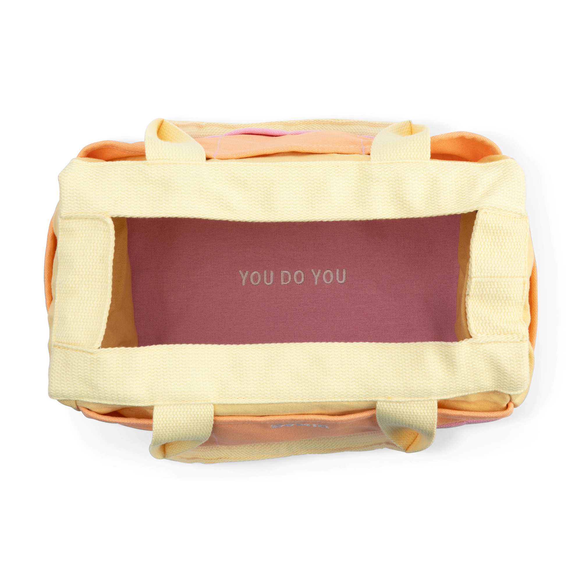 Yellow pet carrier with 'YOU DO YOU' branding on a white background