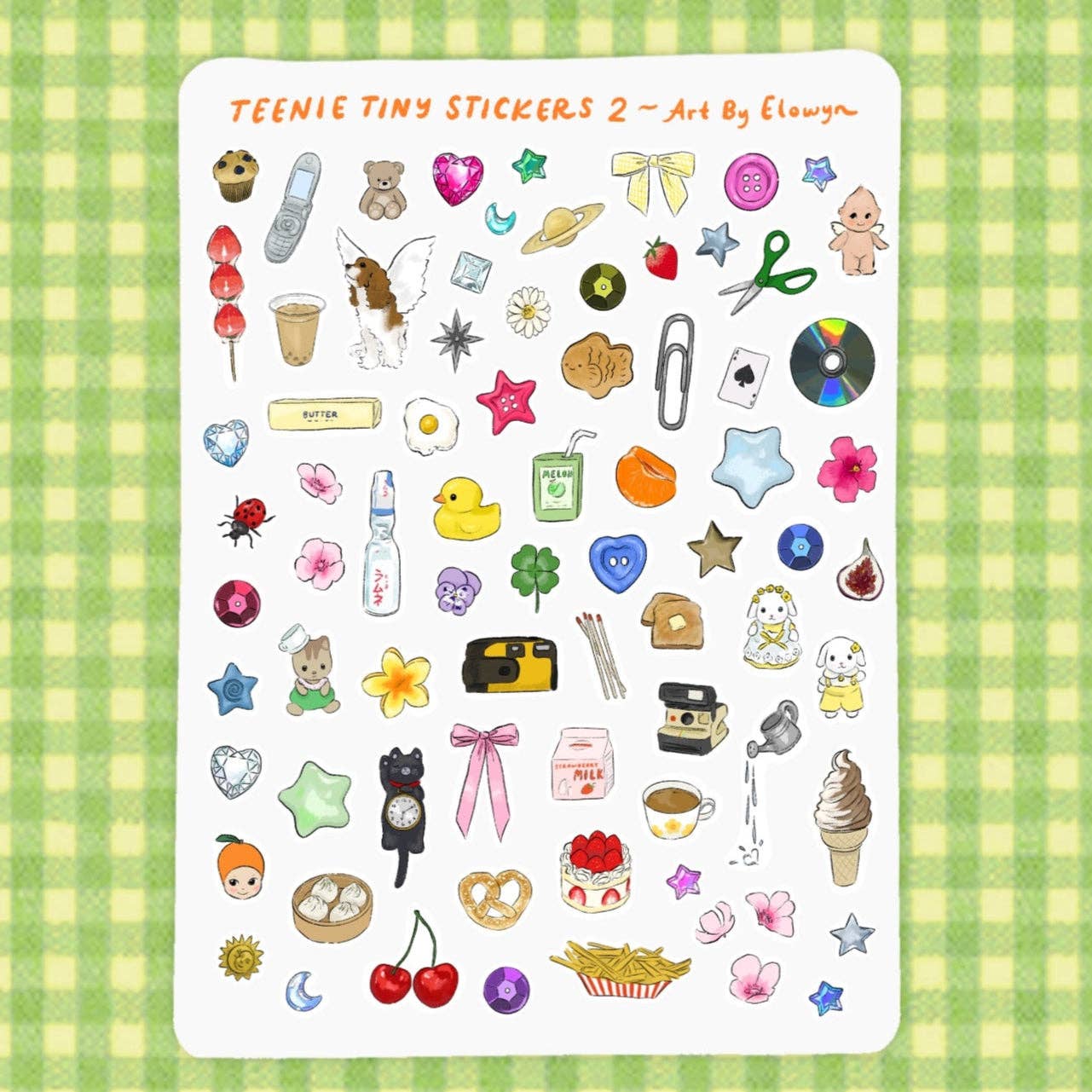 Sheet of Teenie Tiny Stickers 2 by Elowyn on a green checkered background