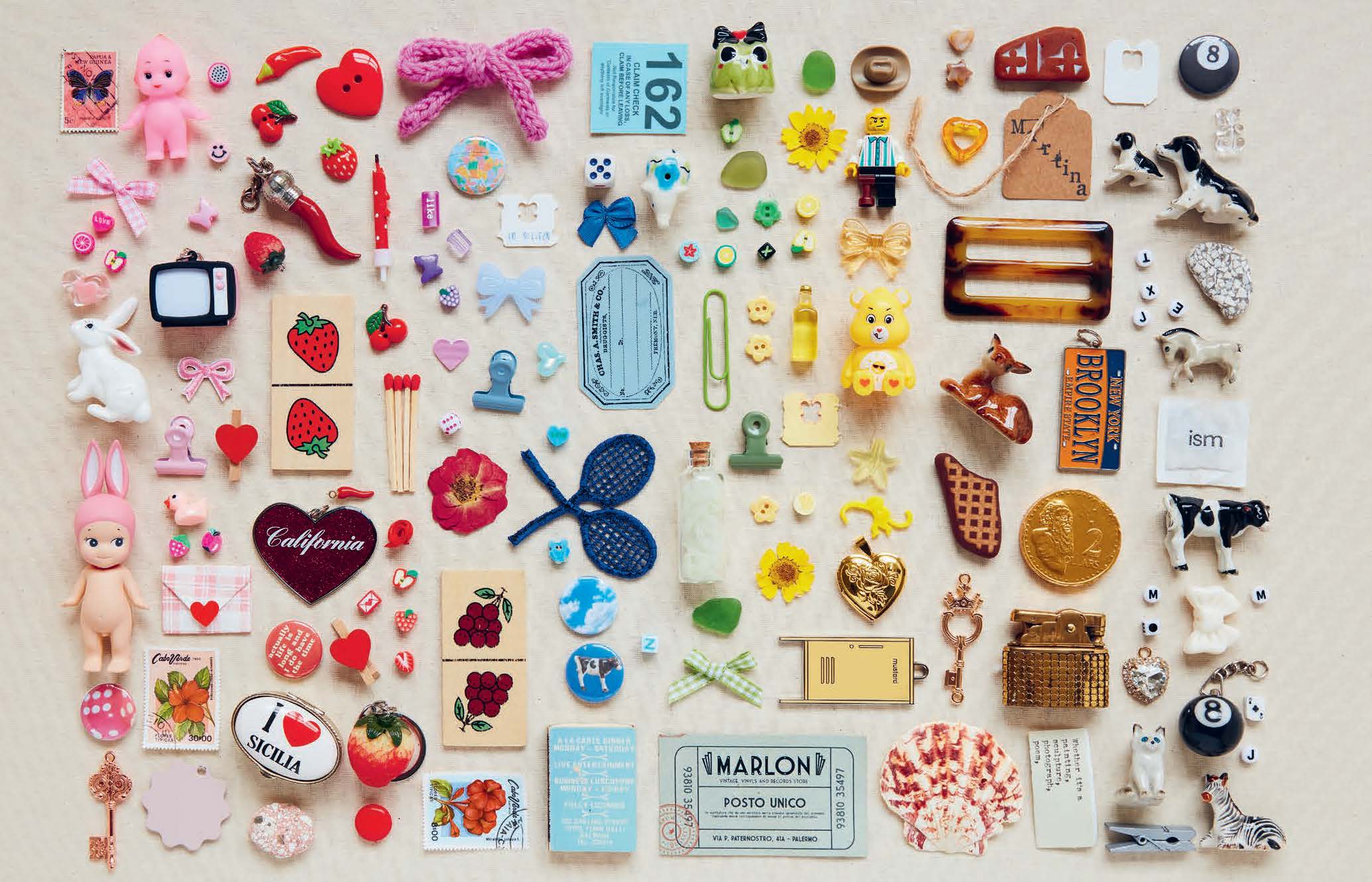 Collection of various small decorative items arranged in a grid on a light background