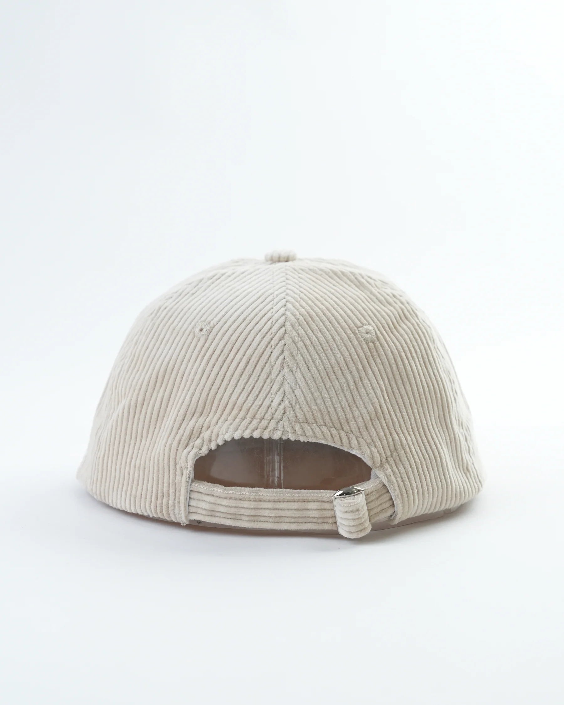 Beige corduroy cap on a white background