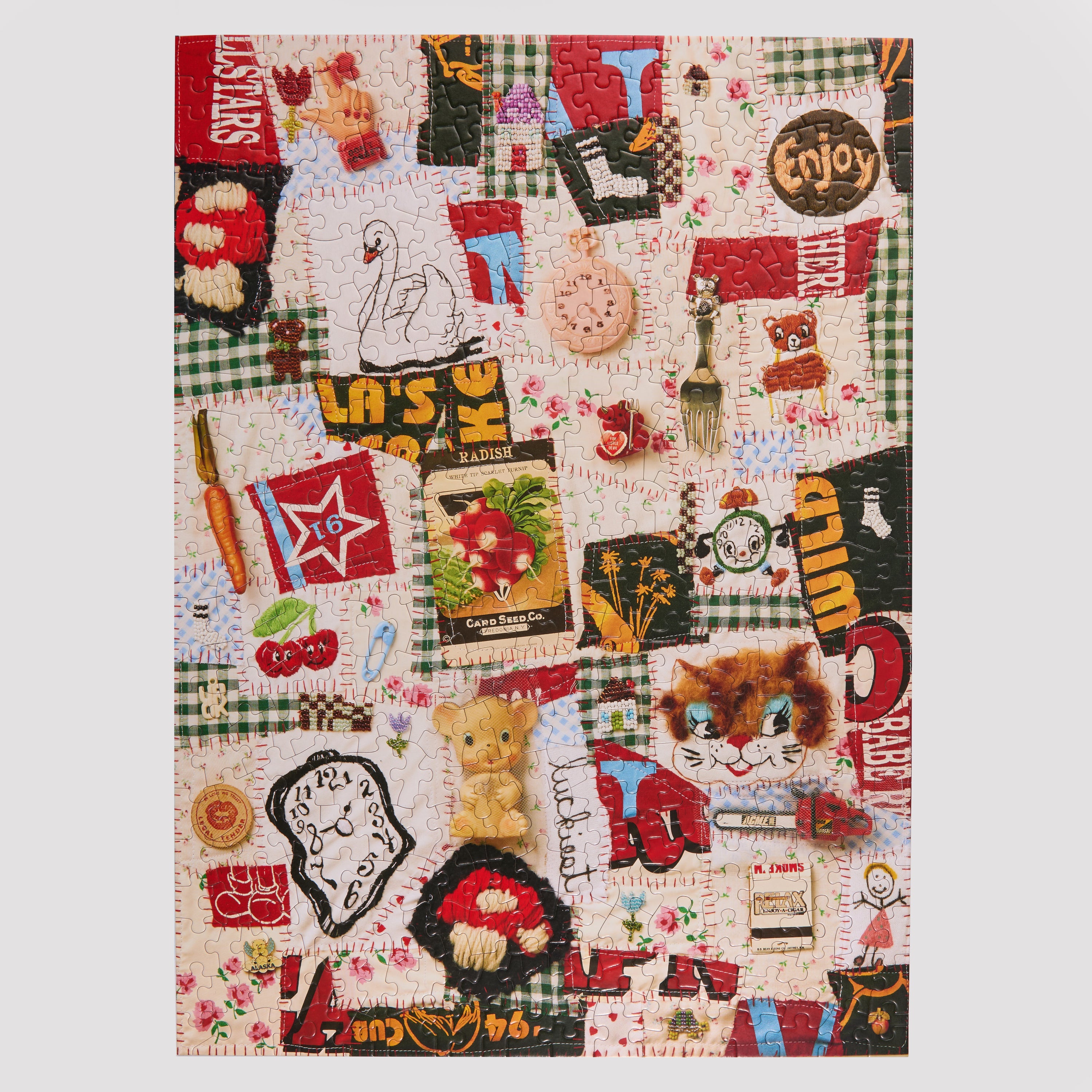 Patchwork quilt with various patterns and text on a white background