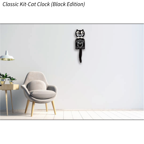 Black cat-shaped clock on a white wall with a modern chair and table in the foreground.
