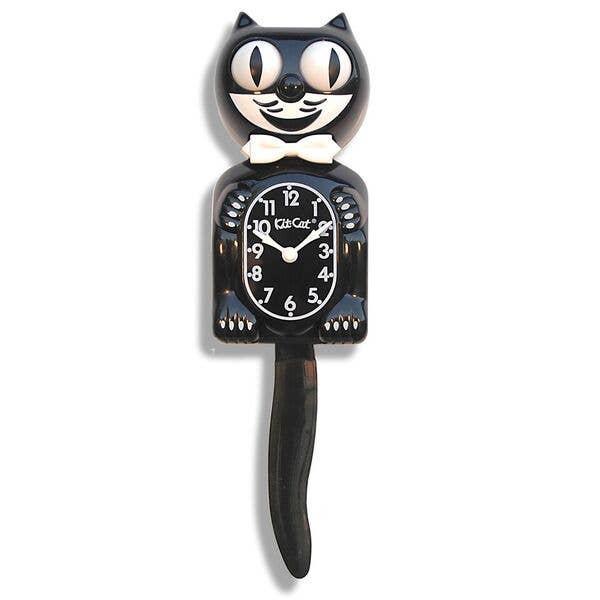 Cat-shaped clock with a black body and white face on a white background