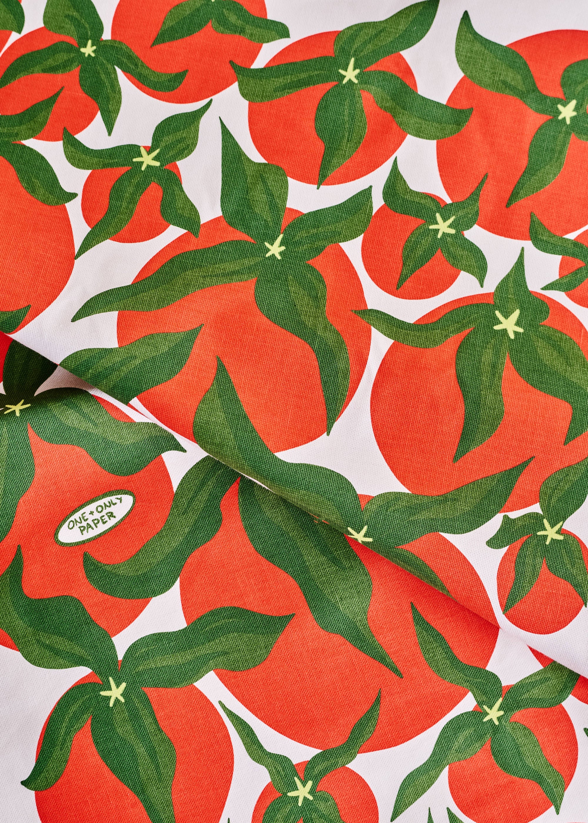 Pattern of red fruits with green leaves on a white background