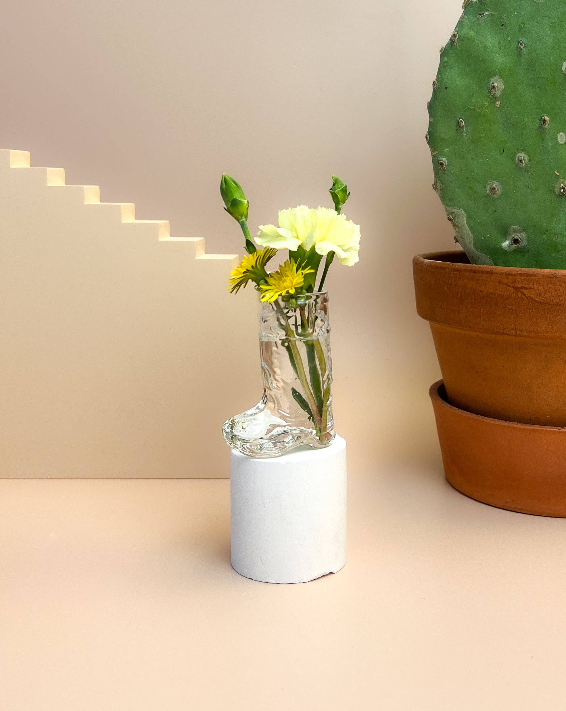cowboy boot shot glass used as a mini vase