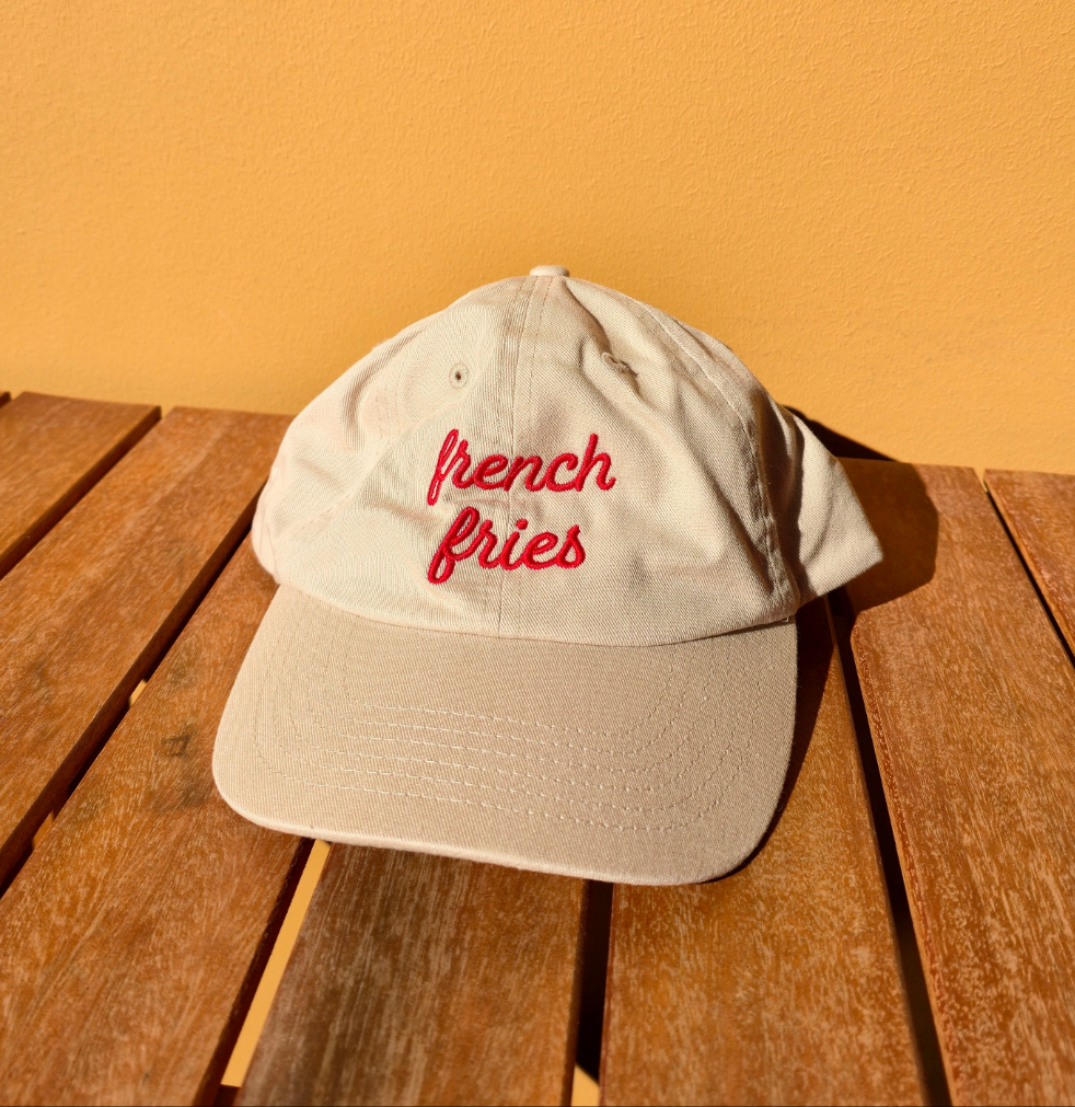 French Fries corduroy cap flat lay on a neutral background