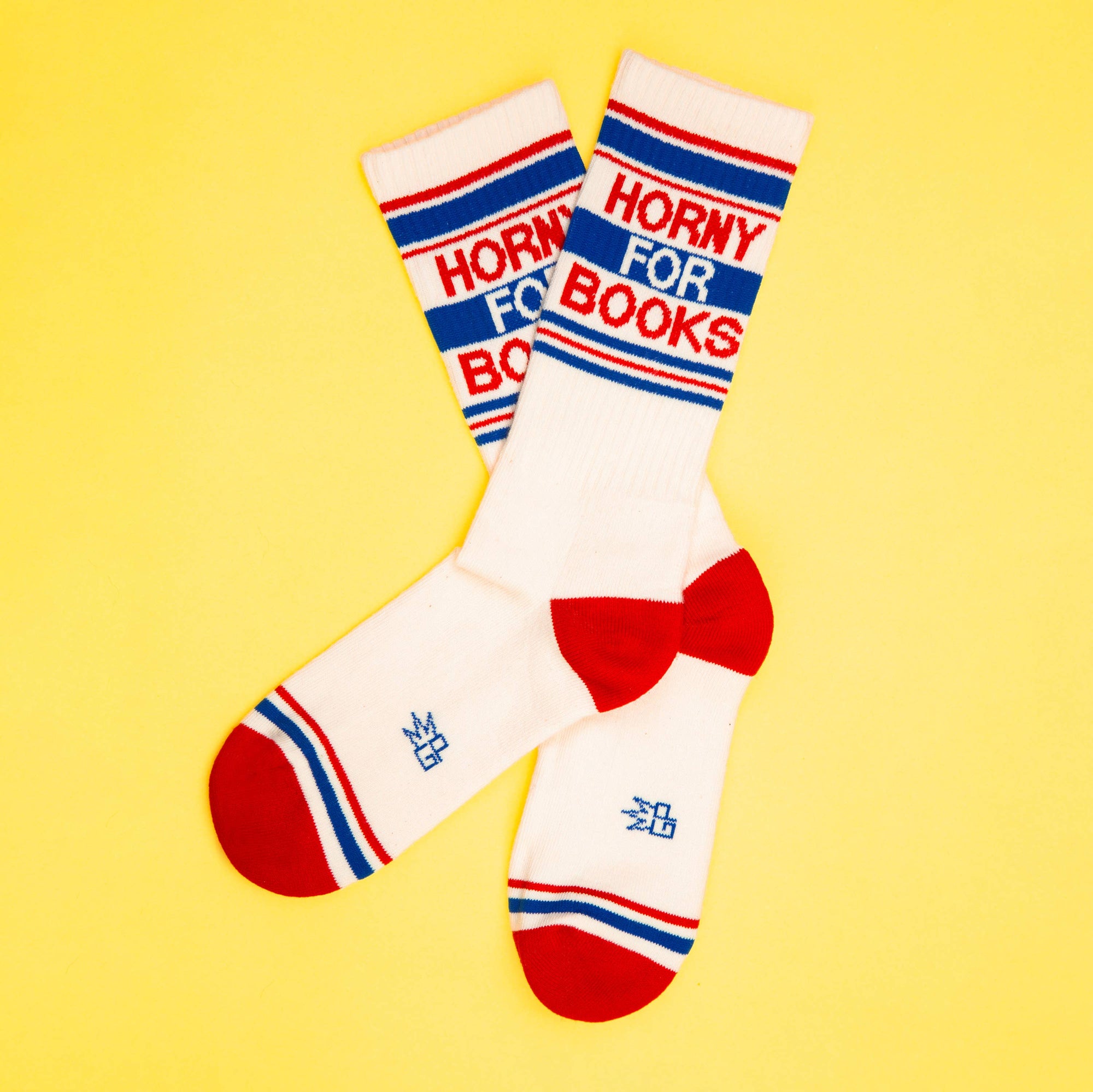 Socks with ' Horny for books' text on a yellow background