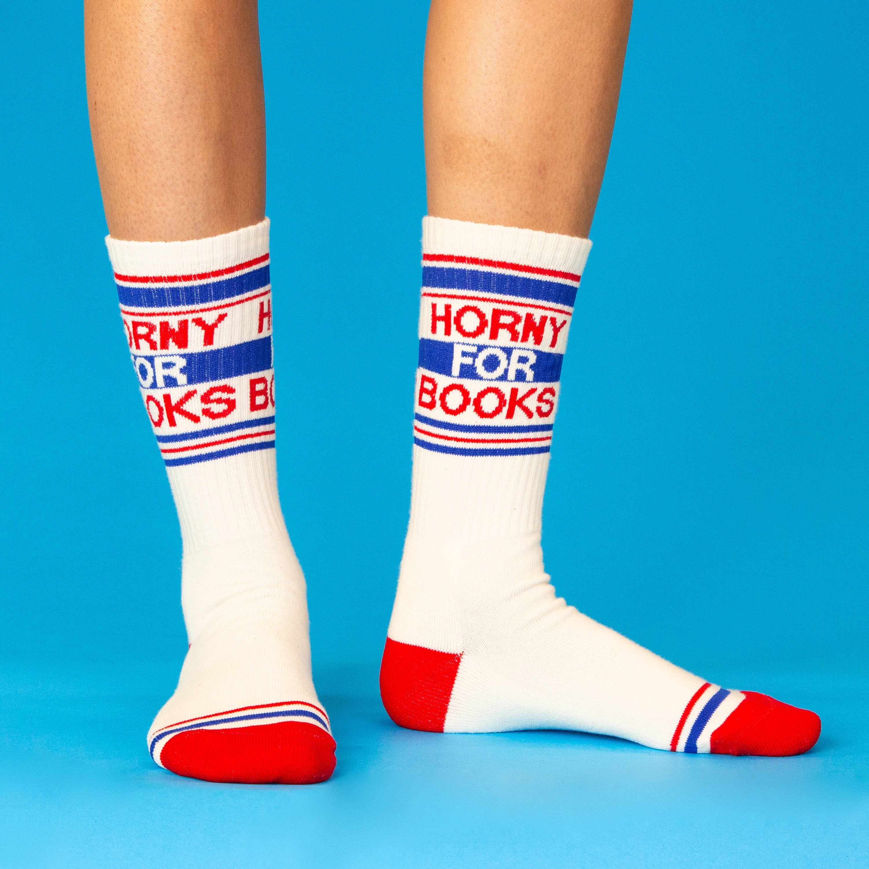White socks with red, blue, and white text on a blue background
