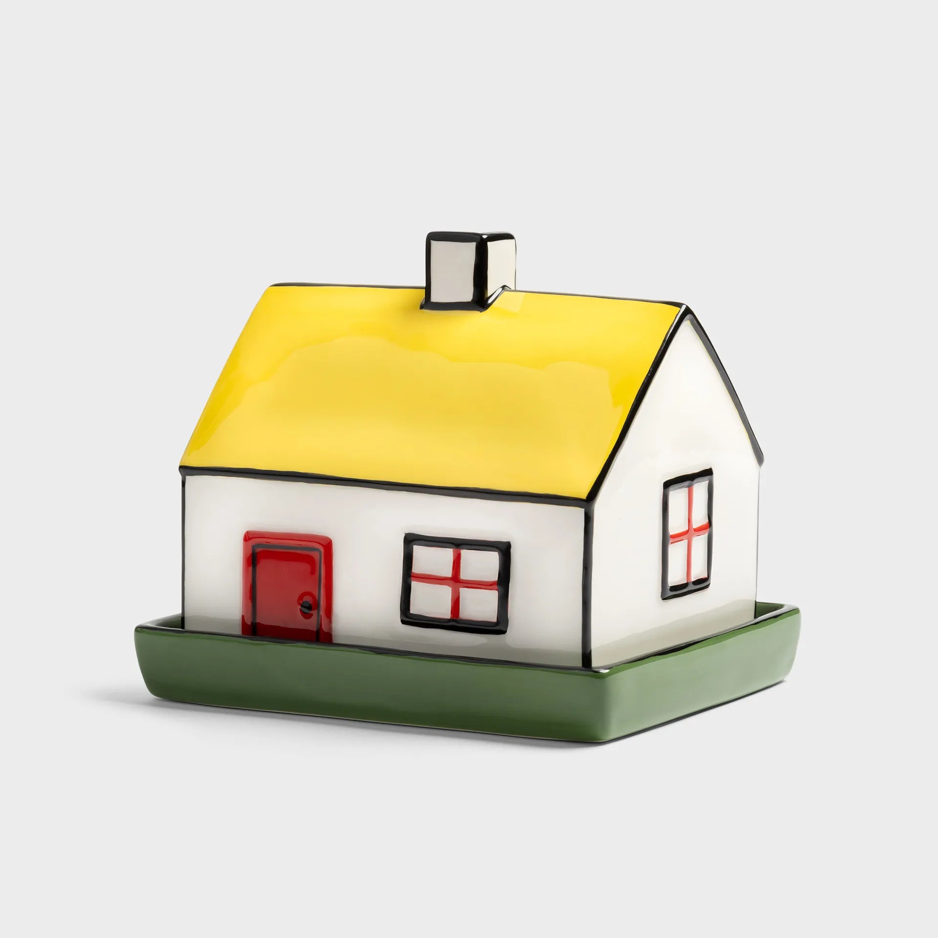 Model of a house butter dish with a yellow roof on a white background