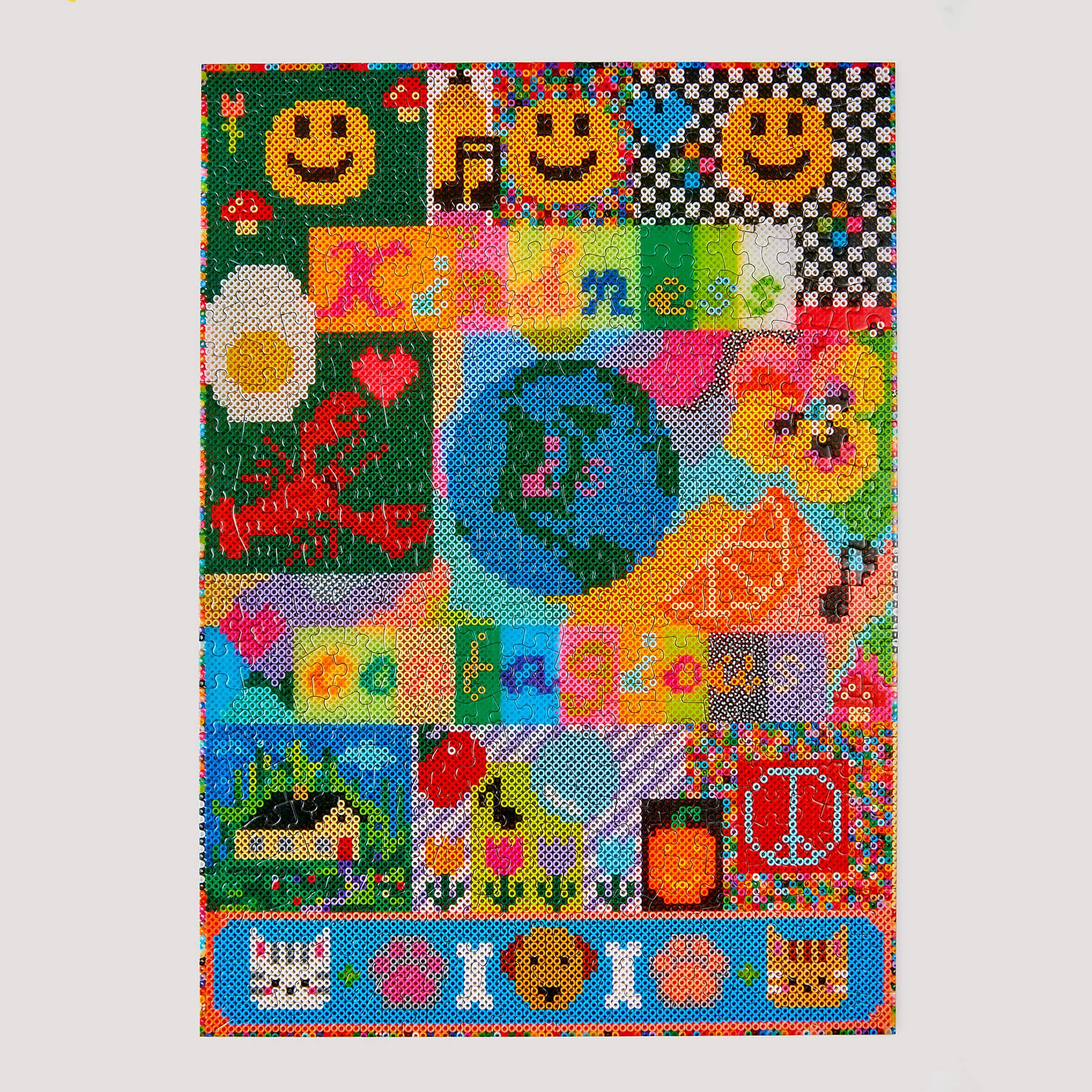 Colorful cross-stitch pattern with various symbols and text on a white background