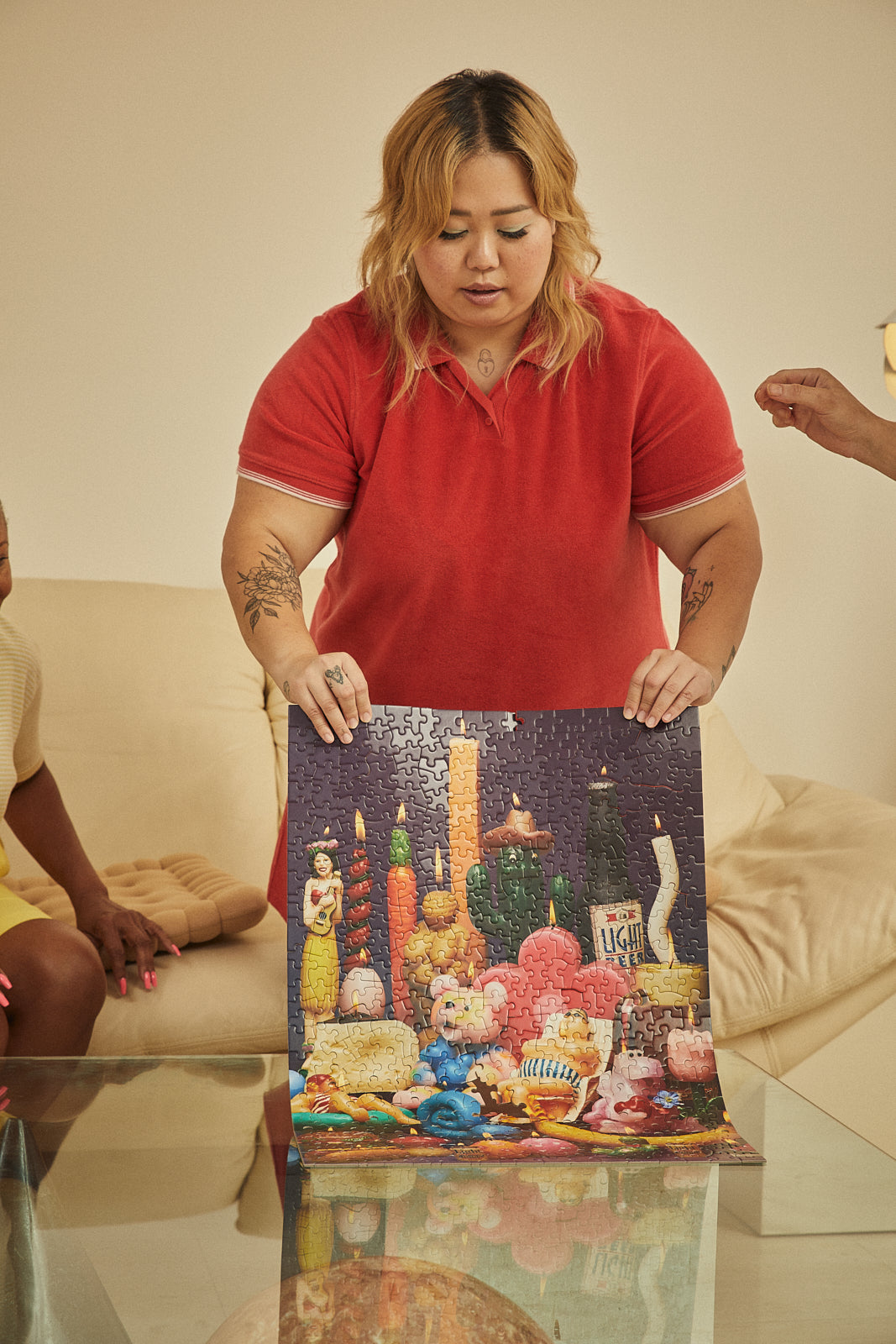 le puzz lighten up 500 piece puzzle being held up after completed
