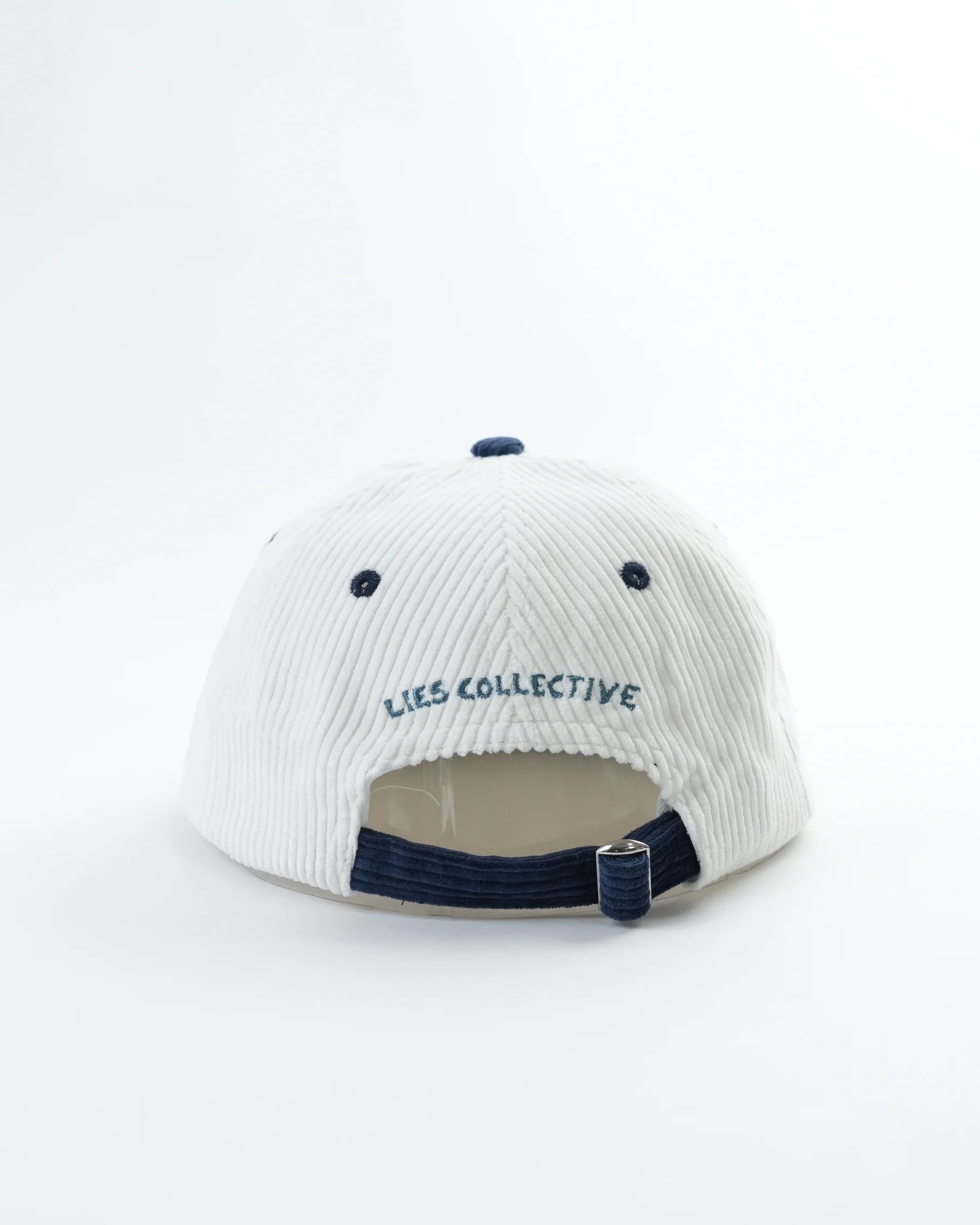 White cap with 'LIES COLLECTIVE' branding on a white background