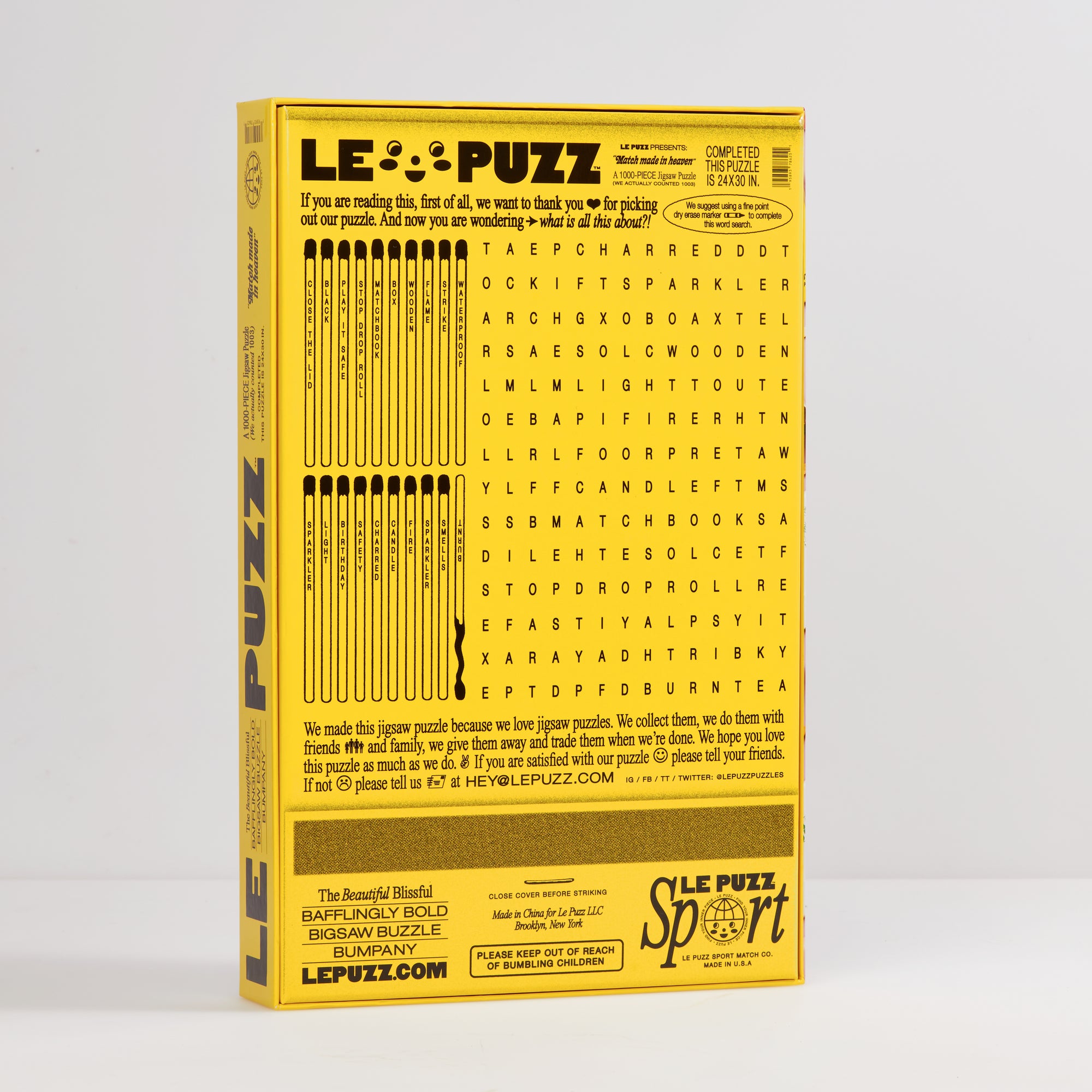 Le Puzz Match Made in Heaven puzzle box back – yellow with word search and matchstick illustrations