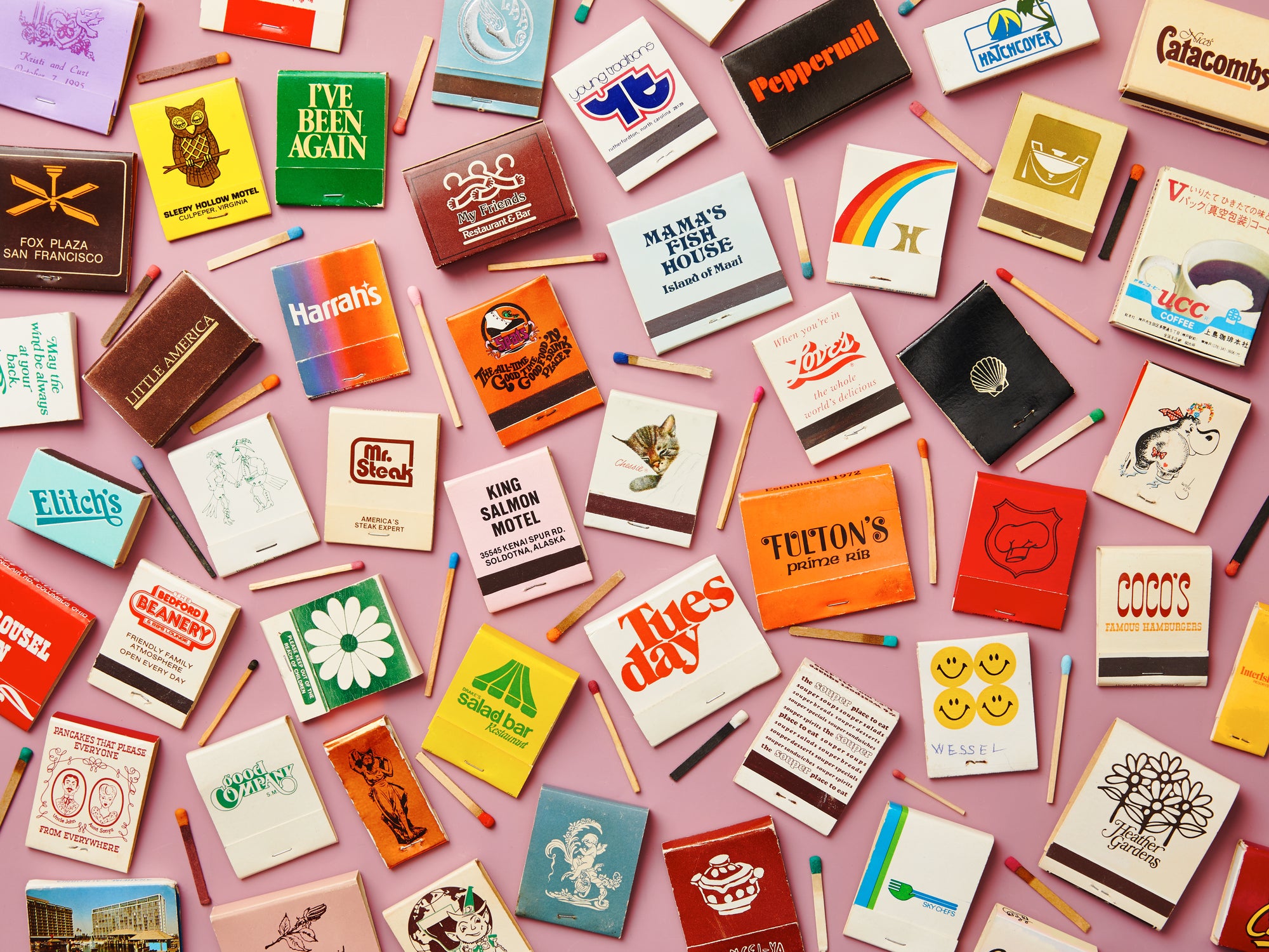 Le Puzz Match Made in Heaven puzzle image flat lay – colourful vintage matchbook collection on pink background