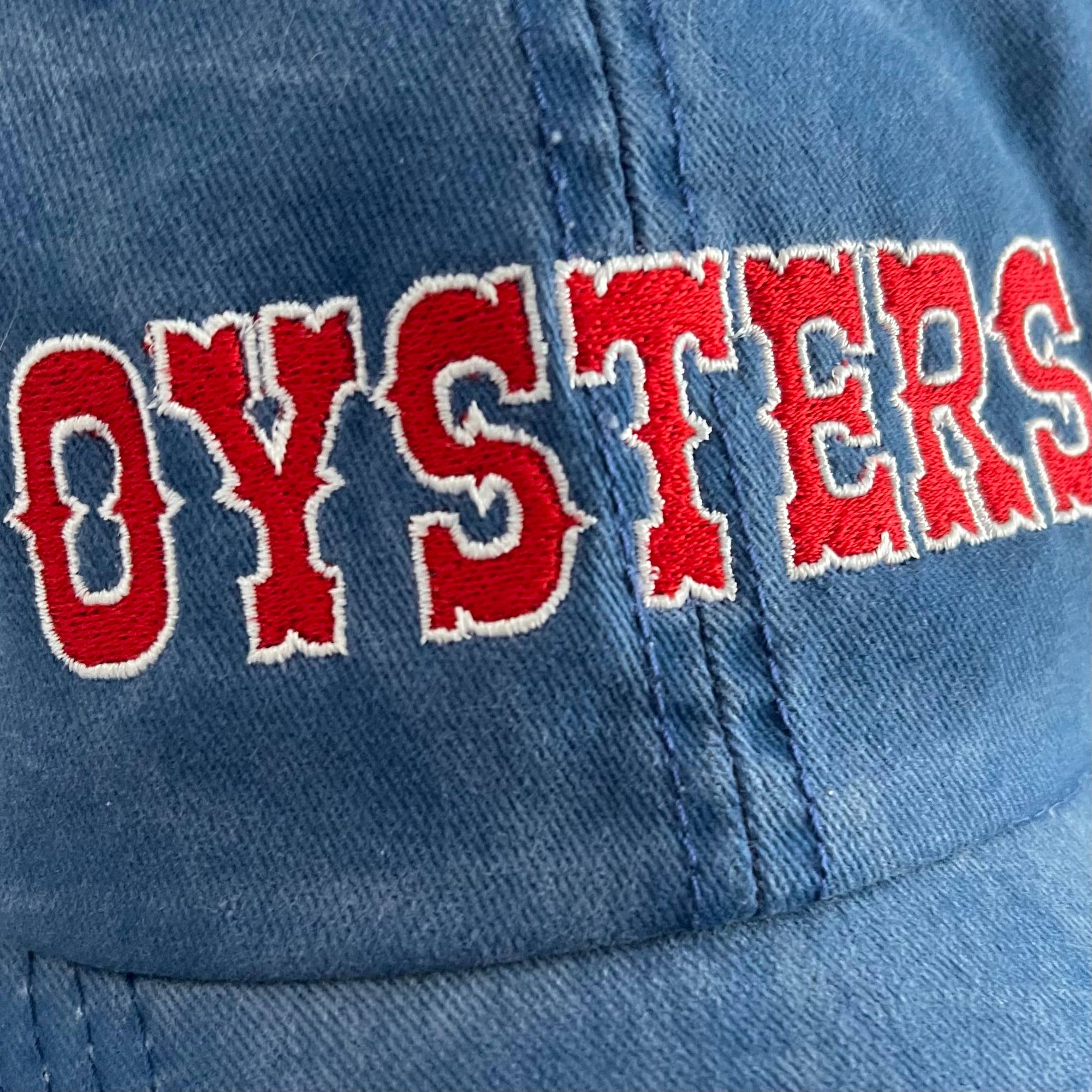 Blue cap with red and white 'OYSTERS' text
