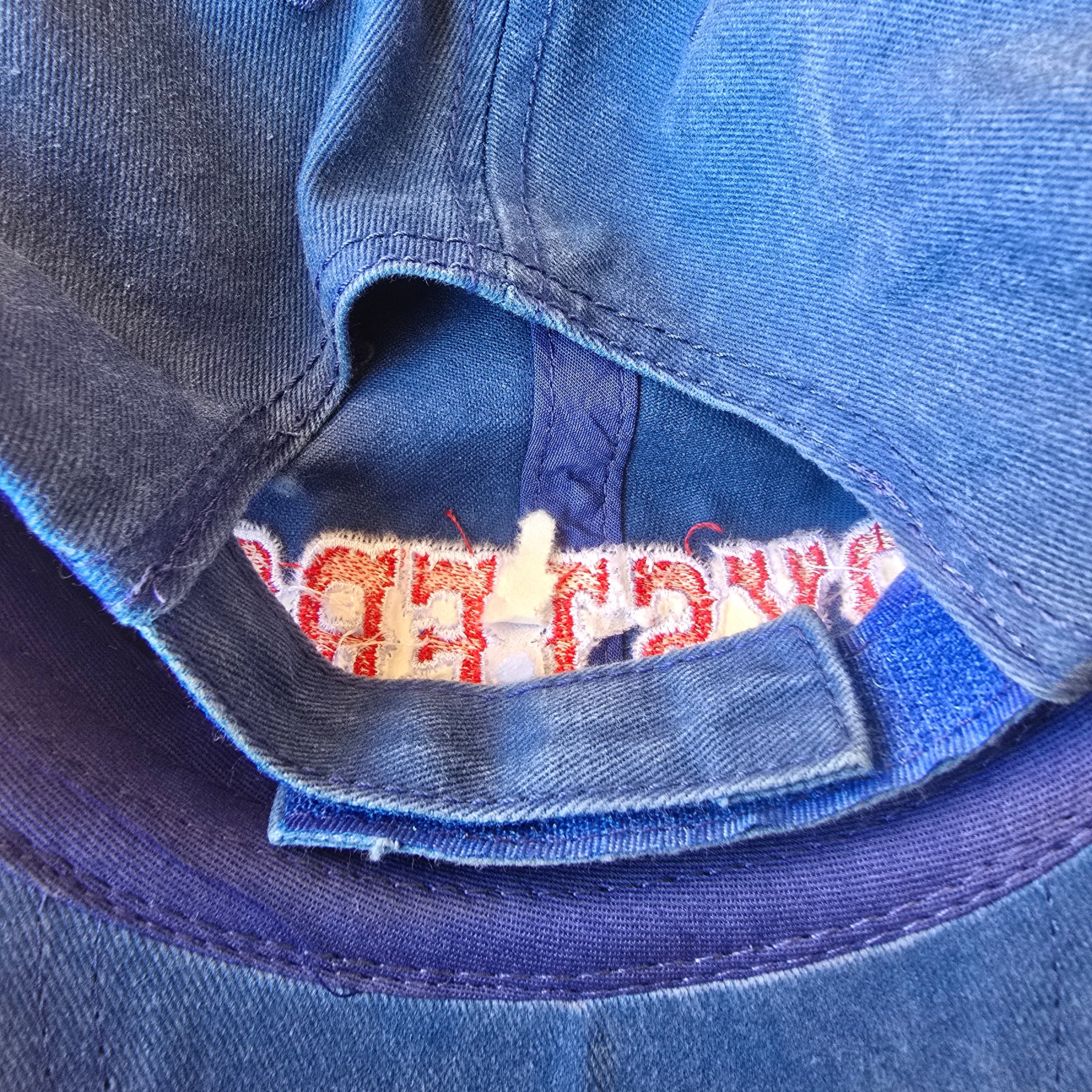 Close-up of a blue denim fabric with a brand label.