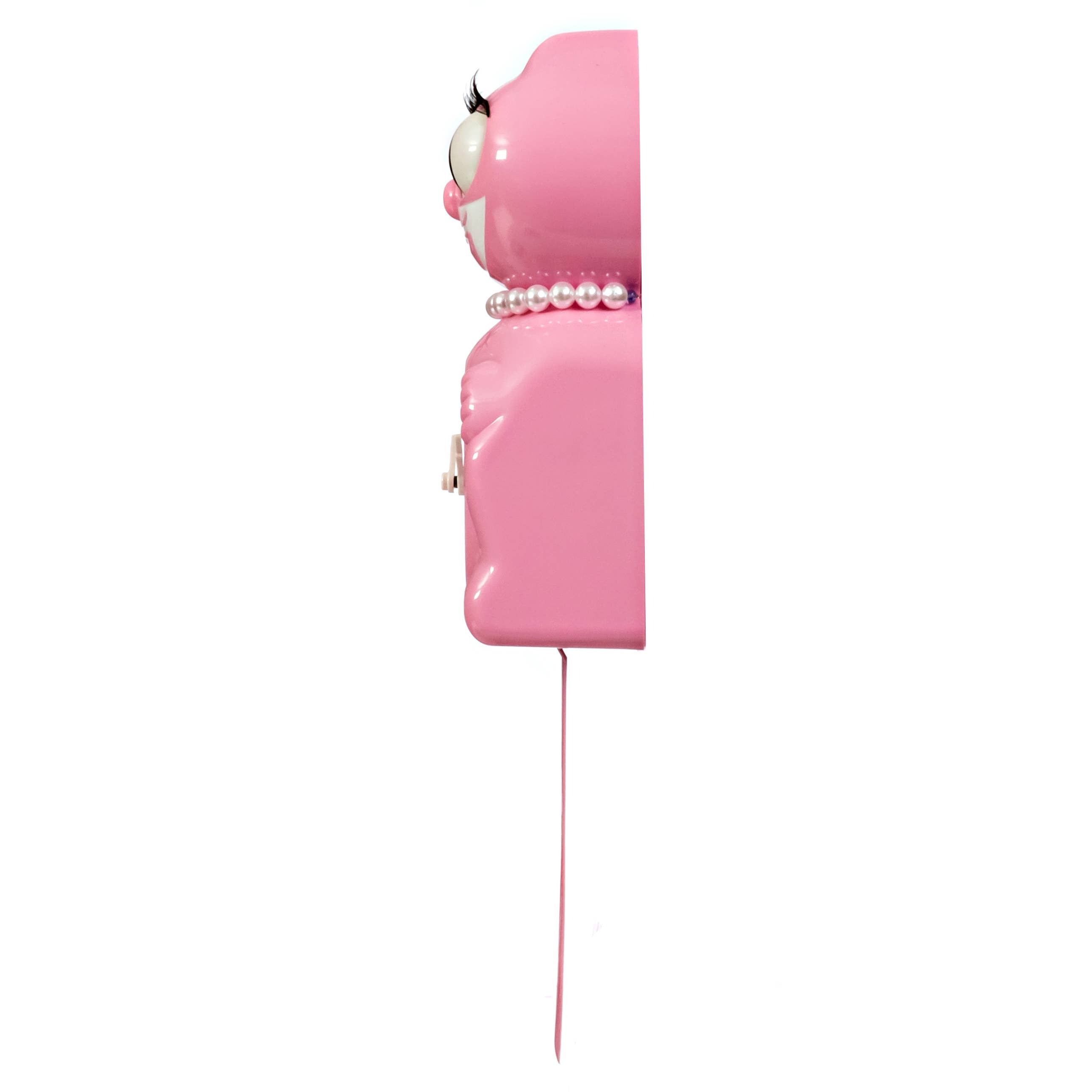 Pink wall-mounted phone with a white face on a white background