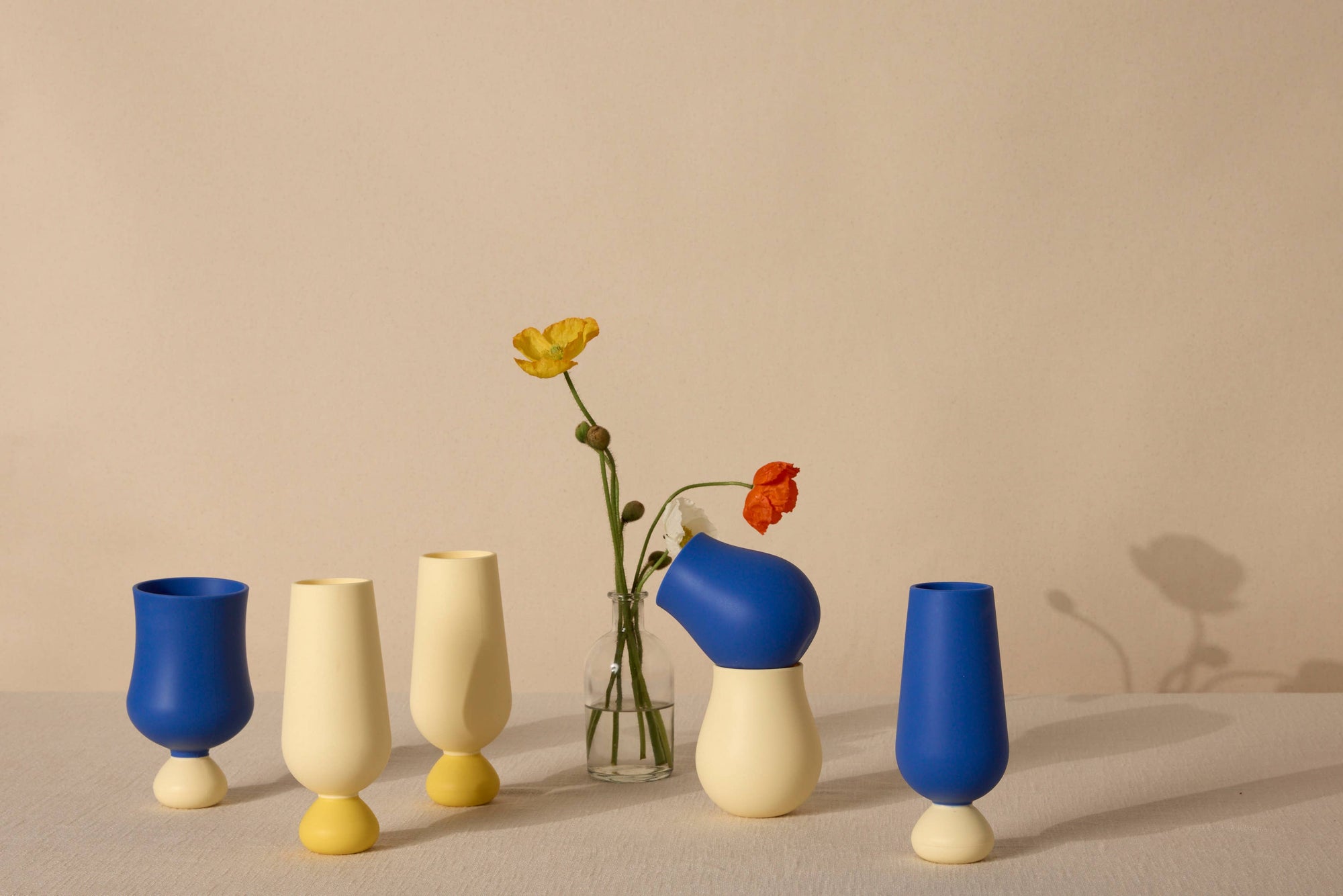 Set of colorful styld cups on a neutral background