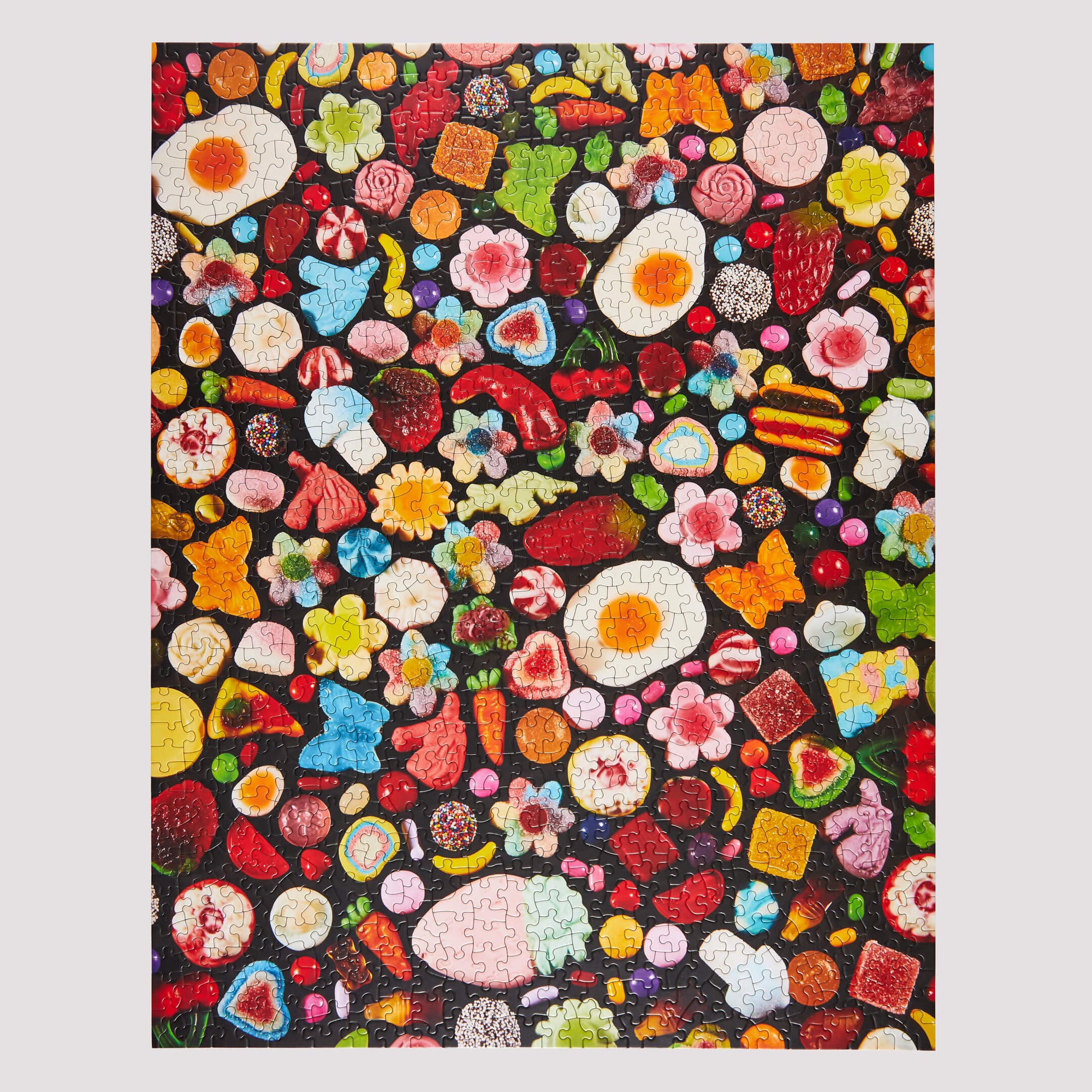 Colorful pattern of various food items on a black background