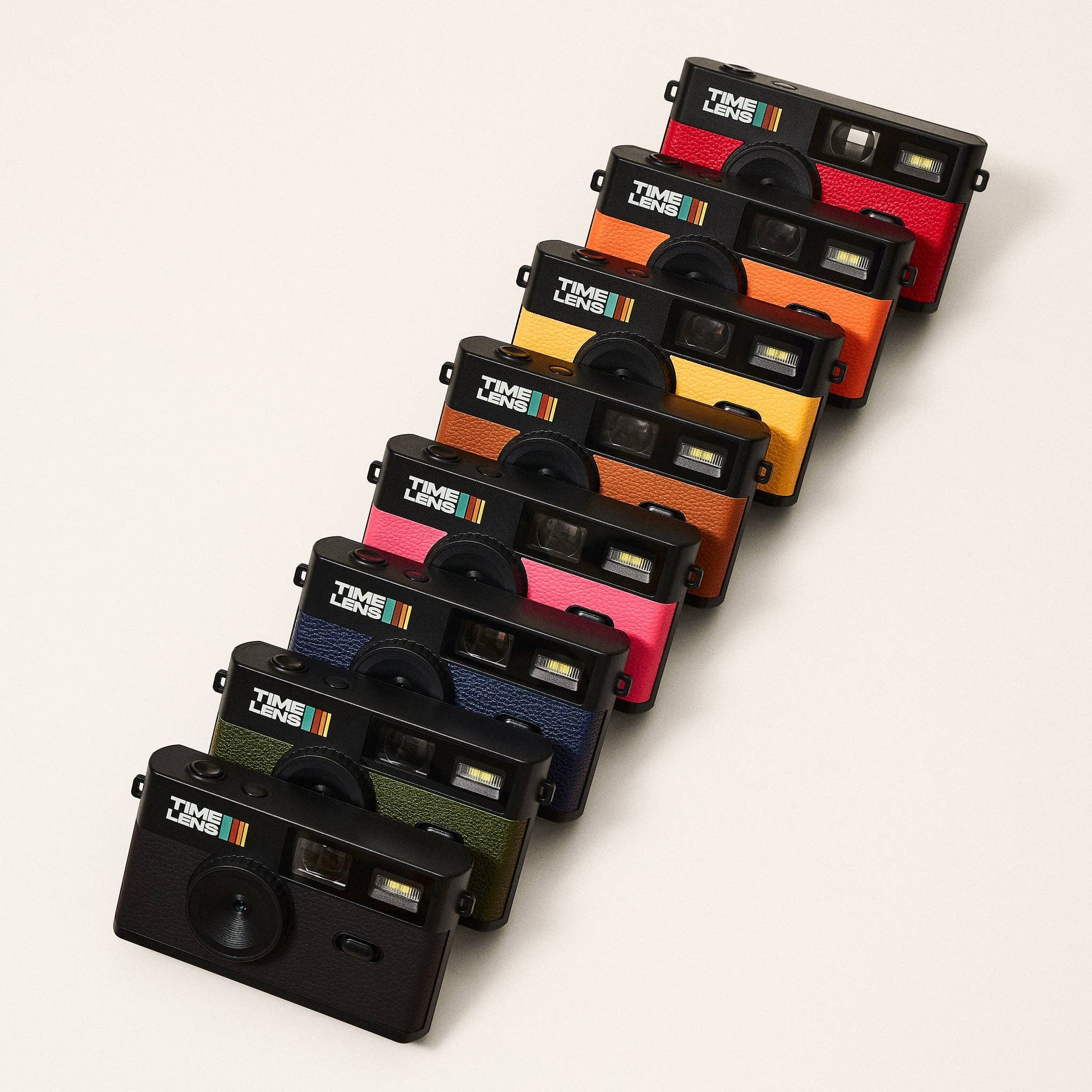 Set of Time Line instant film cameras in various colors on a white background
