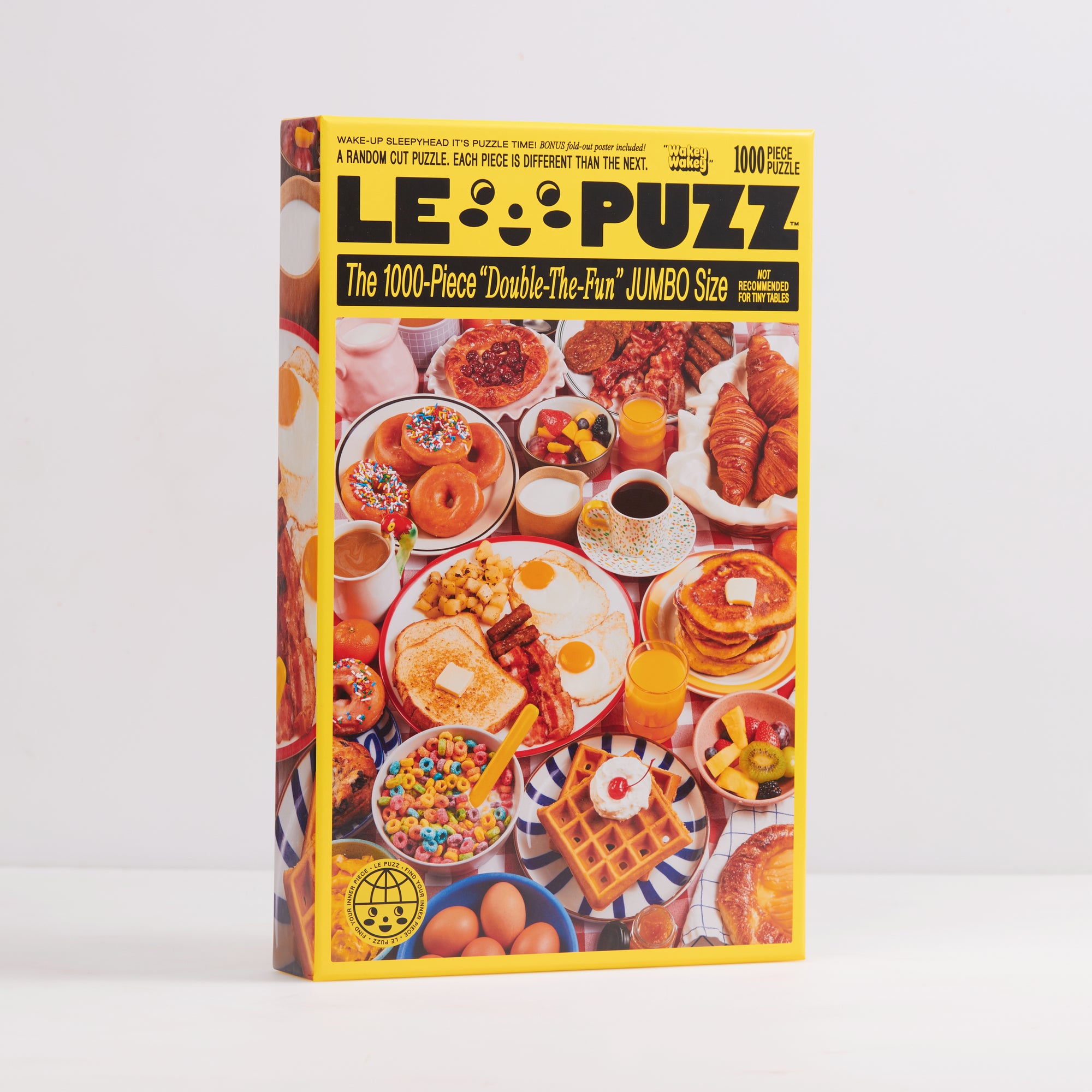 Le Puzz Wakey Wakey 1000-piece jigsaw puzzle box front showing a colourful breakfast spread with donuts, eggs, waffles, pancakes, and cereal