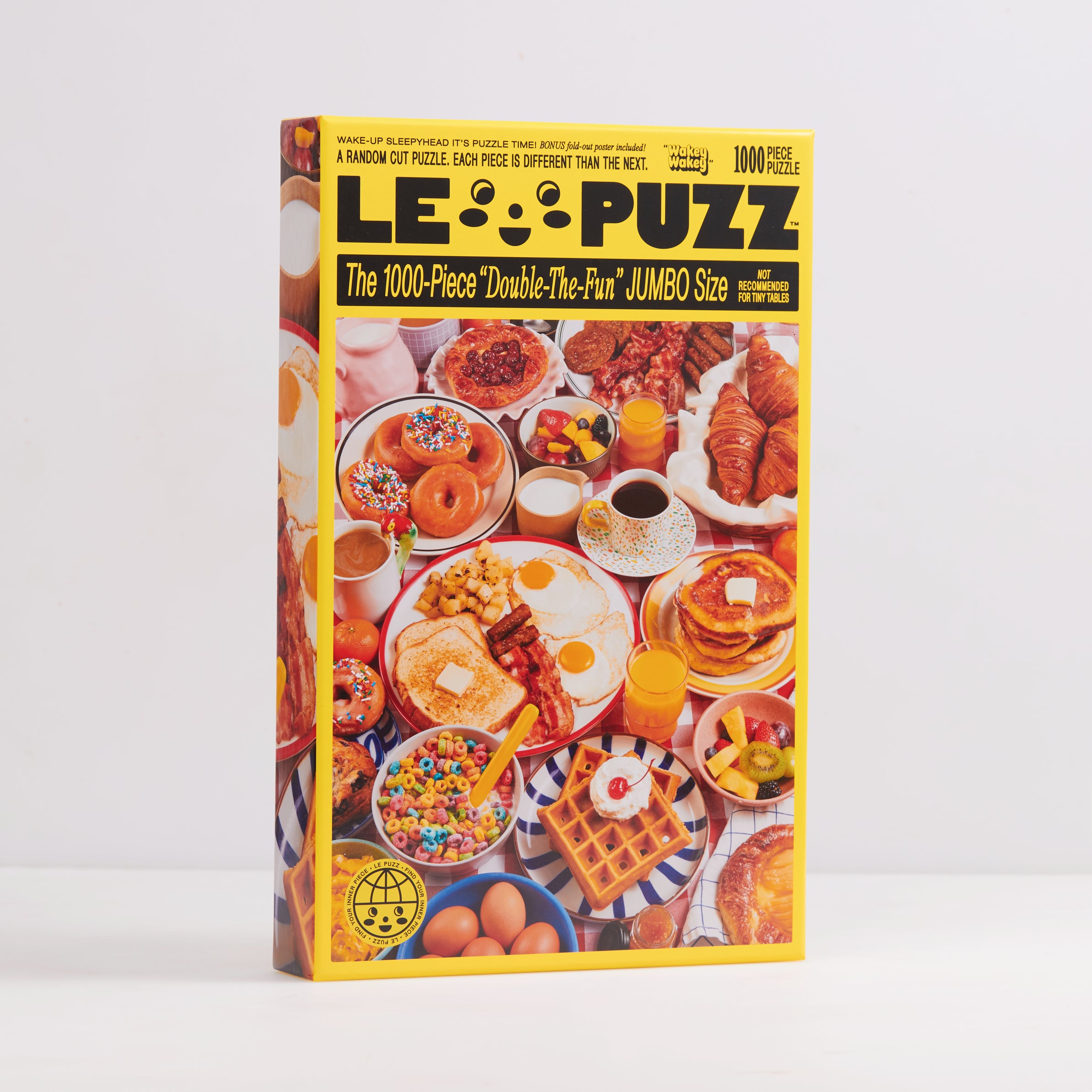 Le Puzz Wakey Wakey 1000-piece jigsaw puzzle box front showing a colourful breakfast spread with donuts, eggs, waffles, pancakes, and cereal