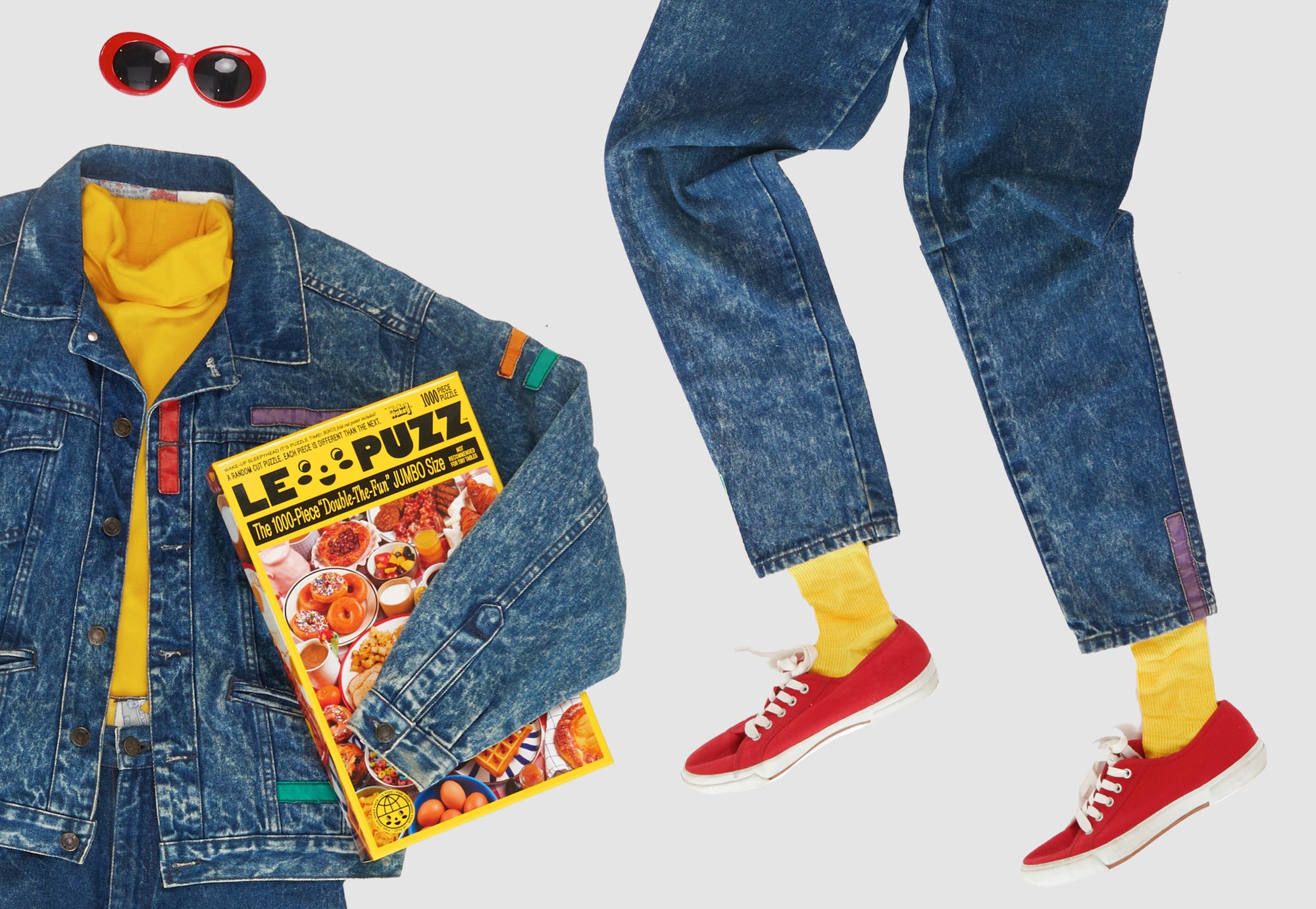 Le Puzz Wakey Wakey puzzle box styled with a denim jacket, yellow turtleneck, red sneakers and retro red sunglasses