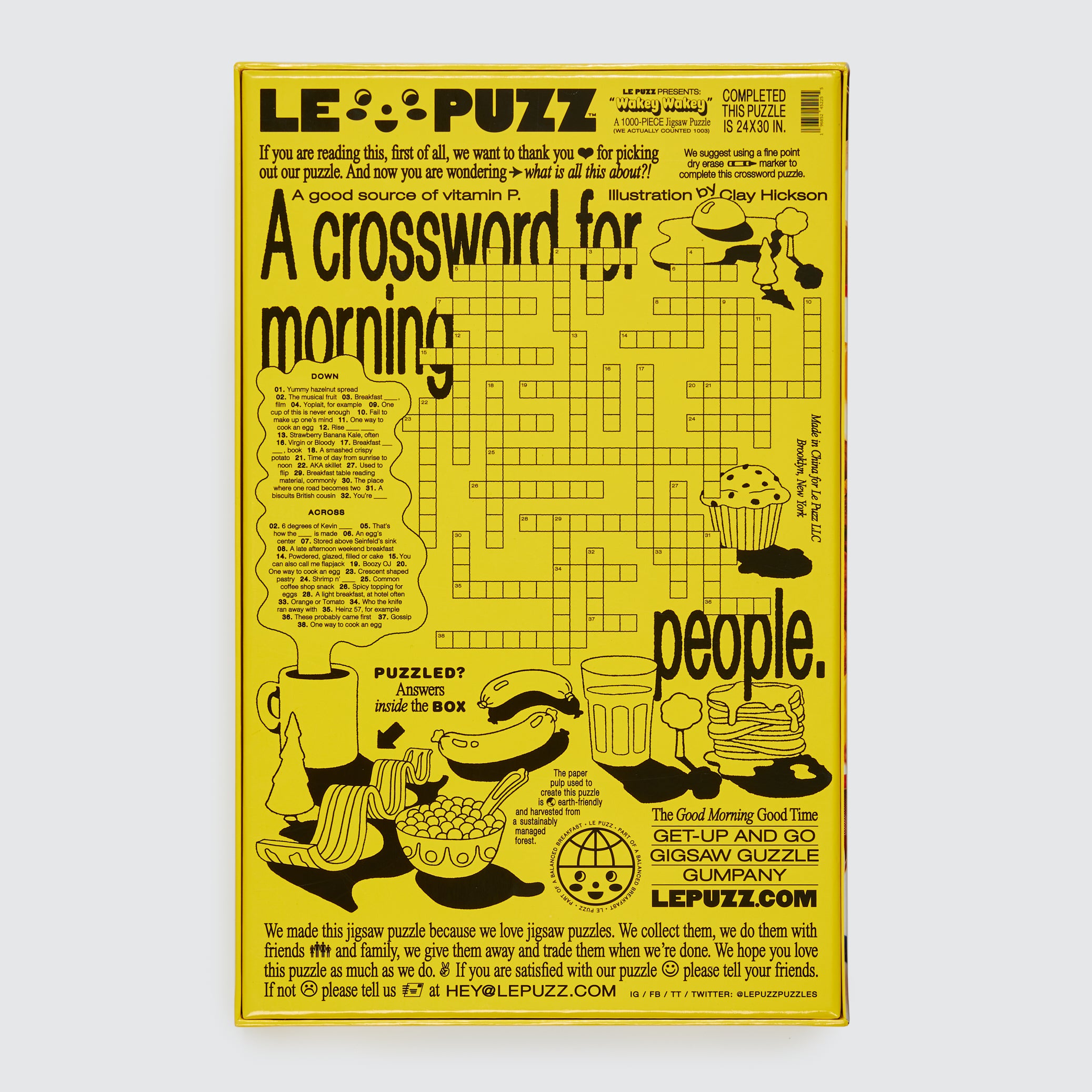 Le Puzz Wakey Wakey puzzle box back featuring a breakfast-themed crossword puzzle illustrated by Clay Hickson on a yellow background